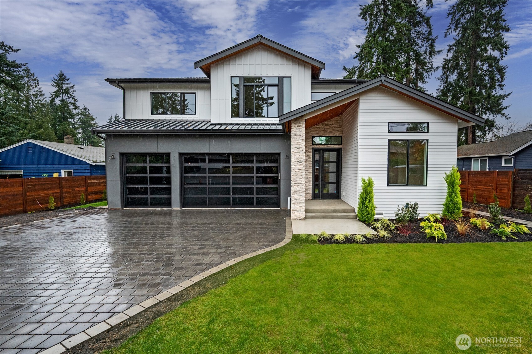 Luxury presale from Asheville Homes in coveted Shoreline Schools! This 5 bed, 4.5 bath stunner offers a grand entry, vaulted ceilings, and a chef’s kitchen with Calacatta Laza Oro quartz, custom cabinetry, walk-in pantry, and stainless appliances. Primary suite boasts a heated bathroom floor, soaking tub, walk-in shower, and wrap-around covered porch. Enjoy year-round outdoor living on the covered deck with built-in fireplace. 3-car EV-ready garage, office, bonus room, and energy-efficient systems. Close to I-5 and the light rail. Completion late February.