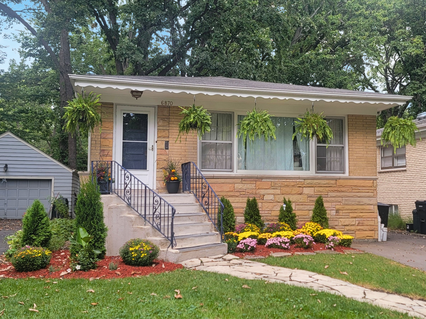 Lovely home on a deep lot in the heart of the idyllic Wildwood neighborhood. 3 bedrooms on the main floor, along with an updated full and half bath. Stainless appliances and plentiful cabinet space in the kitchen with granite counters and breakfast bar. Finished basement with recessed can lighting and wet bar, along with an impressive spa-like bathroom with separate shower and jetted tub. There's a laundry room and utility room for additional storage. Great back yard with thoughtful landscaping. Steps from St. Mary of the Woods and Wildwood Elementary Schools and Wildwood Park.