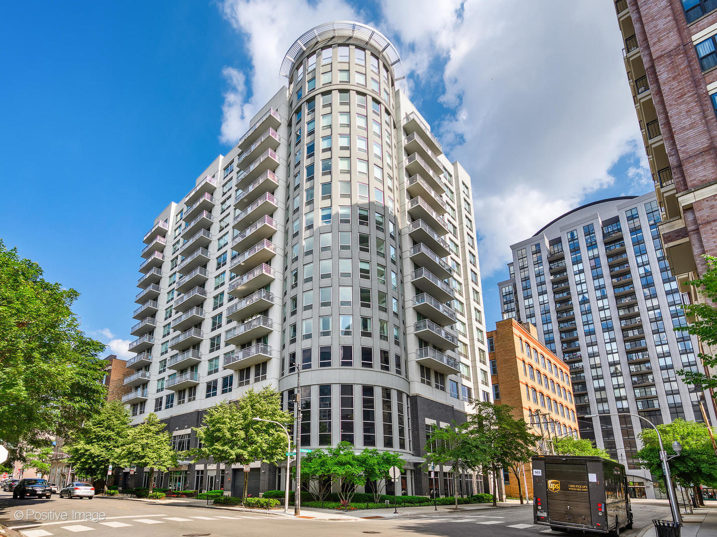 This beautifully updated 2-bedroom, 2-bathroom corner unit in the heart of River North offers breathtaking skyline views, modern finishes, and a desirable split floor plan. The open-concept living and dining area flows into a thoughtfully renovated kitchen, where the homeowners extended the island to create substantial additional storage and counter space, complemented by elegant waterfall quartz countertops, a full-height backsplash, and high-end KitchenAid stainless steel appliances. The primary suite includes two generous closets and a fully reimagined bathroom with dual sinks, a walk-in shower with frameless glass doors, and all-new fixtures. The second bathroom also features updated tile, vanity, and fixtures. Throughout the home, newer oak hardwood floors are paired with premium oversized roller shades, sleek black hardware, and modern lighting. A spacious 21x5 south-facing balcony provides a front-row seat to dramatic city skyline views. The full-amenity building features a 24-hour doorman, fitness center, and a rooftop deck perfect for relaxing or entertaining. Tucked away on a rare, quiet, tree-lined street, you're still just moments from the best of River North, with easy access to the Brown and Purple Lines and 90/94. Heated attached garage parking on the second floor is available for $35K.