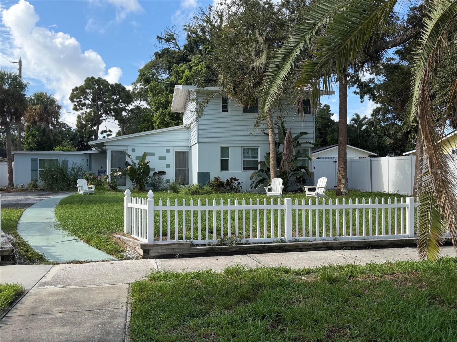 REMODELED!! Your BEACH HOUSE away from the beach! North Shore Park is quaint waterfront neighborhood between Edgewater Drive and Intercoastal! 1 block to the water, even a glimpse from your front yard! Ride your bike to Downtown Dunedin! Short stroll to sunsets on Edgewater Park! Neighborhood access to intercoastal water! This UNIQUE HOME is for the "artsy" buyer that is tired of the cookie-cutters and looking for something special! Professionally staged to show off its maximum potential! Basically a 1-story home with 2nd-story master retreat! Custom-finished staircase takes you to your private master bedroom! Upstairs master suite has a private bathroom and walk-in closet! Remodeled master bathroom with a newly tiled walk-in shower, new vanity, lighting and mirror! Not a fan of stairs, there is a 2nd master/in-law suite downstairs! This home is tucked away on large lot just off Edgewater Drive! We hope you'll appreciate the new & improved and very "beachy" curb appeal! Freshly painted, new sod, new landscaping, new front wood fence & driveway privacy gate....complete with a new white picket fence! 2021 flat roof/shingle roof 2011. Step inside to a totally renovated interior! Again, this mid-century house has now been refurbished with a very coastal vibe to it! Beamed vaulted wood ceilings! A wall of windows brings the outside in! Brand new wood (vinyl) floors throughout trimmed in high baseboards! Coolly painted and textured throughout! Brand new kitchen complete with QUARTZ COUNTERS, mini-breakfast bar, glass tile backsplash, new cabinets, and stainless steel appliances! Downstairs bedroom and full guest bathroom! Bathroom is freshly updated with a newly tiled shower/bath, new vanity, lighting and mirror! Hallway takes you to a Private wing that includes the laundry room, bonus/family room, and a 2nd master suite! Laundry/utility room has a new water heater and updated electrical box! BIG storage closet! Bonus room has French doors to a small side patio! Barn door from the family room slides open to a 3rd bedroom that would be a perfect in-law set-up or teen bedroom! Bedroom has double closets, beamed ceiling, recessed lighting, and its own full bathroom! 3rd bathroom is also brand new with resort style finishes! Taking advantage of this home's unique layout, the entire home's heat/cooling is done by 5 brand new remote-controlled mini-split AC units! Each section of the house can be individually temperature controlled to your satisfaction....and trust me, they blow super COLD! New windows throughout the entire home with all new faux wood blinds! New fans, fixtures, doors throughout! Looking for a place to relax and have a cocktail, step out back onto your brand wood deck! Serene spot for entertaining or summer cook-outs! Maintenance-free Backyard is totally fenced and accented with new landscaping! Get the smores ready for nighttime gatherings on the sand around the fire pit! Eclectic up-and-coming neighborhood in the heart of everything! Just north of Dunedin and about a 10-minute drive to Clearwater Beach! Million dollar waterfront homes just down the block! (Could also be a perfect Air BNB) Enjoy your beach home away from the beach!s