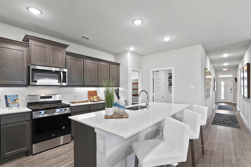 MLS# 20492533 - Built by Trophy Signature Homes - Ready Now! ~ Perfect proportions and an abundance of well-placed features make the Oscar a blockbuster design you’ll love coming home to. Say hello to the sun as it streams through oversized windows in your primary suite. Just around the corner is your home office, an inviting space that encourages creativity and offers an escape to the back patio or the ultra-modern kitchen when it’s time for a break. Family life is centered in the great room with a cozy family room, chic dining area and an ultra-modern kitchen. Three additional bedrooms located near the front of the house are private, quiet and serene!!