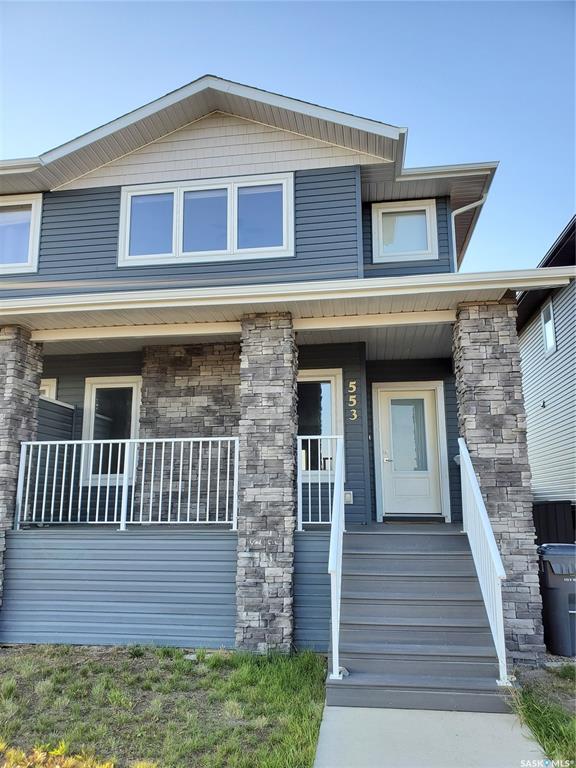 This standout end unit townhome at 553 Douglas Drive, Swift Current, combines quality craftsmanship, a prime Sask Valley location, and a layout designed for everyday ease. The elevated front deck looks out toward Ecole Centennial School, giving you a pleasant view before you even step inside. The main floor offers a smooth, open flow with a welcoming living room leading into a sharp-looking kitchen featuring dark, rich-looking cabinetry, stainless steel appliances, granite counters, a four-seat island, and a built-in desk for quick tasks. The bright dining area opens to a private back deck, fenced yard, and double gravel parking, while the rear entry brings extra storage, a plug-in for your deep freeze, and a handy half bath. Upstairs, you will find two comfortable secondary bedrooms, including one with a walk-in closet, the laundry area, and a full bathroom, followed by a generous primary suite with its own spacious walk-in. The finished basement rec room adds bonus living space with a bathroom already roughed in. The home’s mechanicals include a heat recovery unit, a high-efficiency furnace, central air conditioning, underground sprinklers, a fire suppression system, and hard-wired smoke detectors to complete a package that is comfortable, convenient, and safe. If you want a home that performs as well as it looks, this is the one to move on before someone else does.