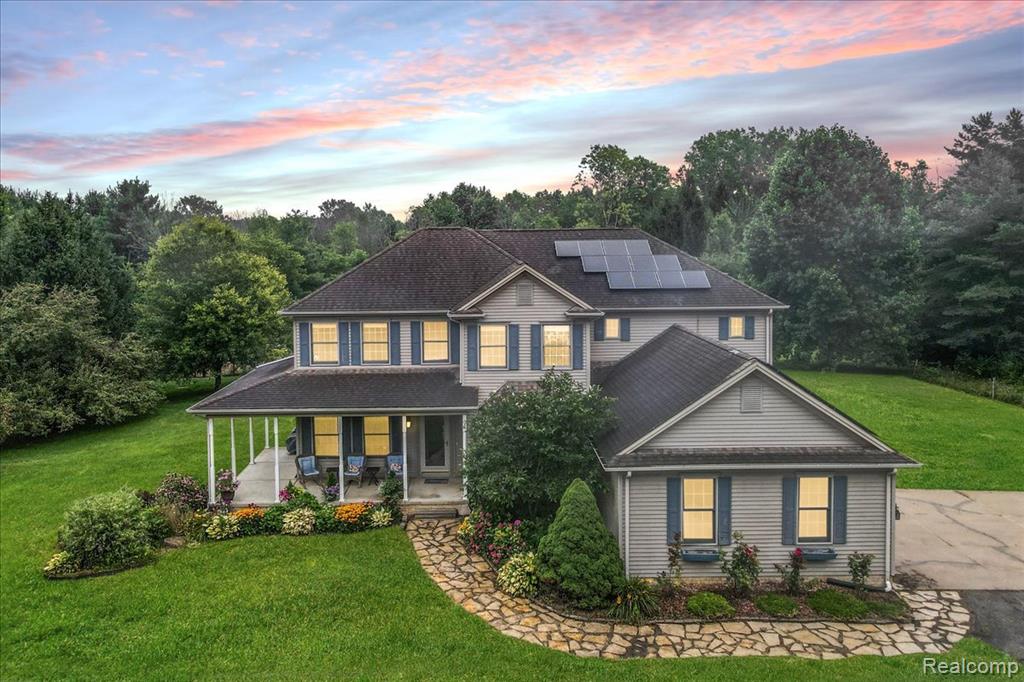 Discover an enchanting home set on sprawling 7.5 acres, where serenity meets the wonders of nature. Just a stones throw off the pavement, the dense tree-lined driveway offers seclusion to your personal sanctuary. A wraparound porch invites you to sit, breathe, and take in picturesque views of meandering wildlife and beautiful landscaping. Outside, an expansive deck overlooks a lush backyard, perfect for gatherings w/ friends or savoring peaceful evenings under the stars. A delightful stocked pond brims w/ bass and bluegill, while a steel-backed shooting wall is ready for practice. Embark on an adventure down one of the wooded trails. Wander through the magnificent 5,000 sq. ft. organic garden and be captivated by the 2 abundant orchards boasting over 30 fruit bearing trees as well as various fruit trees and bushes scattered throughout the property. Indulge in country living w/ a 40x40 chicken yard, where raising your own flock nurtures the soul and offers fresh eggs daily. Inside, discover a gracious two-story great room w/ a charming stone fireplace and warm wood flooring. 1st floor owner's suite features a dreamy pan ceiling and direct access to the deck, ensuring comfort and tranquility. An additional bedroom and office on the main level provide added convenience, along with 1st floor laundry. The kitchen is updated with quartz countertops. All appliances stay. Upstairs, you'll find an expansive Jack and Jill suite and a generous princess suite. The finished basement offers 1,450 sq. ft. of versatile living space, including a sixth bedroom and three additional storage spaces. A 2.5-car garage adds practicality, while your pets will enjoy 5 acres of invisible fencing to frolic freely. Recent updates include furnace, water softener and AC, as well as solar panels which offset daily power consumption. The house is wired for a generator for added peace of mind. Don’t let this rare chance to own a sanctuary of tranquil luxury slip away! Schedule your tour today!