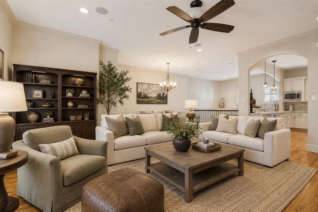 The location is second to none—just one block from West Village, directly across from a large city park, and only a few blocks from the Katy Trail, placing Dallas' best shopping, dining, entertainment, and outdoor recreation right at your doorstep.Designed for both everyday living and entertaining, this spacious residence offers 3 bedrooms, 3.5 baths, a private backyard, and an expansive rooftop deck—creating multiple indoor and outdoor spaces to relax and gather. Venetian plaster walls throughout the entry and second floor add warmth, texture, and architectural character, while rich hardwood floors and abundant natural light enhance the home's inviting atmosphere.The open-concept second floor features a spacious living area anchored by a gas fireplace that flows seamlessly into the dining room and chef's kitchen. The kitchen is equipped with stainless steel appliances, granite countertops, abundant cabinetry, and a walk-in pantry, making it as functional as it is beautiful.The oversized primary suite is a private retreat featuring a spa-inspired bath with dual vanities, a soaking tub, separate walk-in shower, and a generous walk-in closet. Two additional ensuite bedrooms provide exceptional flexibility for guests, family, or a home office, while the convenient powder bath is ideal for entertaining.From morning walks on the Katy Trail to dinner at West Village and evenings on your private rooftop deck, this home offers the perfect blend of timeless style, exceptional outdoor living, and one of Dallas' most desirable walkable locations.