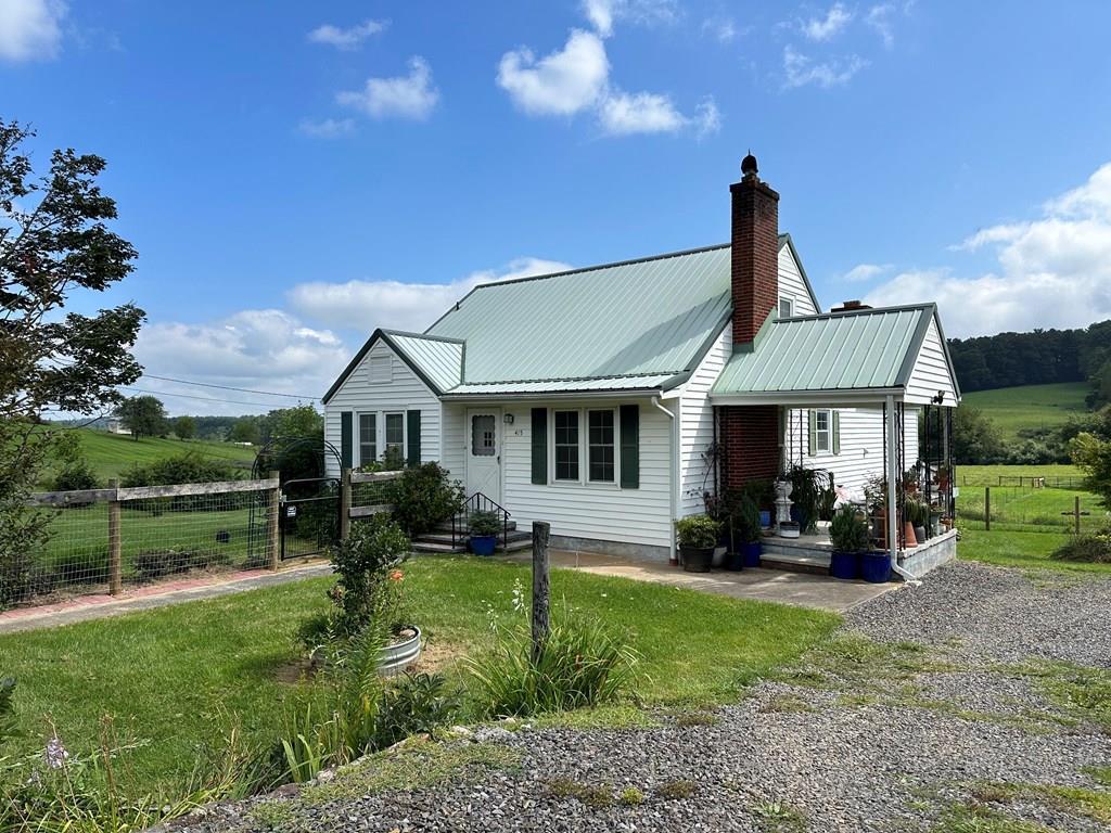 Home with 3.52 acres between Hillsville and Galax. Home features 1284 sq. ft, 3 bedrooms and 1 bath. On the main level you have a living room with a gas log fireplace & hardwood flooring, eat in kitchen with appliances conveying including washer & dryer, family room with gas log fireplace, 2 bedrooms with hardwood flooring and bathroom. On the upper level you have 2 rooms that both could be used as bedrooms with laminate flooring. An oil furnace serves the house for heat. Replacement windows. The walkout basement has 808 sq. ft. Land features 3.52 acres, pastureland, creek, out building, green house, shed, and some fencing. This property is perfect for a mini farm with very usable land and a creek. Great location between Hillsville and Galax right off Hwy 58.