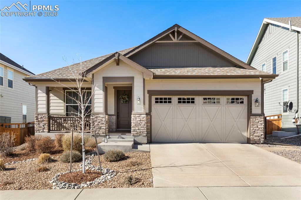 Welcome to The Meadows, an exceptional community, full of trails, parks, schools, & wildlife. You can relax on the inviting front porch before entering this meticulously maintained ranch home that showcases mountain views right from the front door. As you step inside, you'll be greeted by a spacious foyer featuring 8' doors throughout the main level, enhancing the open feel. The versatile front room is adorned with crown molding, making it perfect for a study, or can easily be transformed to a formal living or dining area. The expansive kitchen is equipped with stainless steel appliances, including a gas cooktop above a double oven. It also features 42" upper cabinets, granite countertops, convenient pull-outs, a wine rack, and a generous walk-in pantry for easy organization. Flowing effortlessly from the kitchen is the dining area and great room, complemented by beautiful lighting fixtures and views that can be enjoyed from the entire back of the home. Step out onto the 24'x8' covered deck, which includes auto privacy shades for added comfort and convenience, creating an ideal outdoor space for relaxation. The spacious master suite also offers views and crown molding, along with a well-appointed en suite bath that includes a door for privacy and a sizable walk-in closet. Descend the staircase with wrought iron spindles to discover a large recreation room, currently utilized as an exercise space, along with additional family living space. This level also features a full bathroom and a sizable bedroom complete with a walk-in closet. For your convenience, a large crawl space provides ample storage options, and the home comes equipped with air conditioning for year-round comfort. All cabinetry throughout the home features the ease of soft-close functionality. Lastly, this home includes 2 220-volt outlets in the garage. This beautiful home is move in ready so come enjoy the good life at The Meadows!