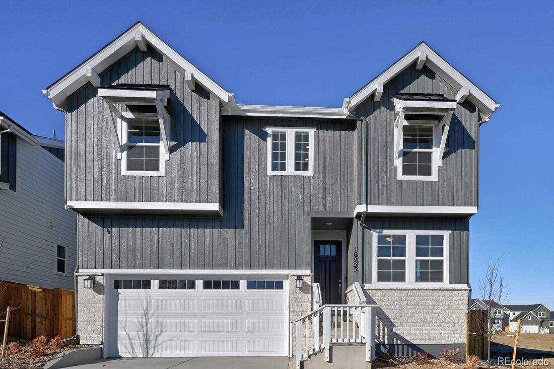 What's Special: 2-Story Great Room with Fireplace | Loft | Oversized Closet in Primary | Oversized Pantry | South Facing. New Construction - Ready Now! Built by America's Most Trusted Homebuilder. Welcome to the Ridgway at 16955 W 92nd Loop in Trailstone Town Collection. This best-selling floorplan blends modern design with everyday comfort, making it a favorite for growing families. The spacious kitchen features an eat-in island and a generous walk-in pantry, opening to a welcoming dining area perfect for gathering. A flexible front room offers space for a home office, playroom, or creative retreat. Soaring ceilings in the great room create an airy, light-filled space ideal for relaxing or entertaining. Upstairs, the private primary suite is complemented by a roomy loft and two additional bedrooms. A two-car garage and large laundry room add convenience and functionality. Set in Arvada’s Trailstone community, you’ll enjoy views of downtown Denver and the Rockies, plus planned amenities like a pool and pickleball courts just steps from home. Additional Highlights include: Old Mill exterior, sleek U kitchen faucet, single basin kitchen sink, satin nickel Genta bath and door hardware.