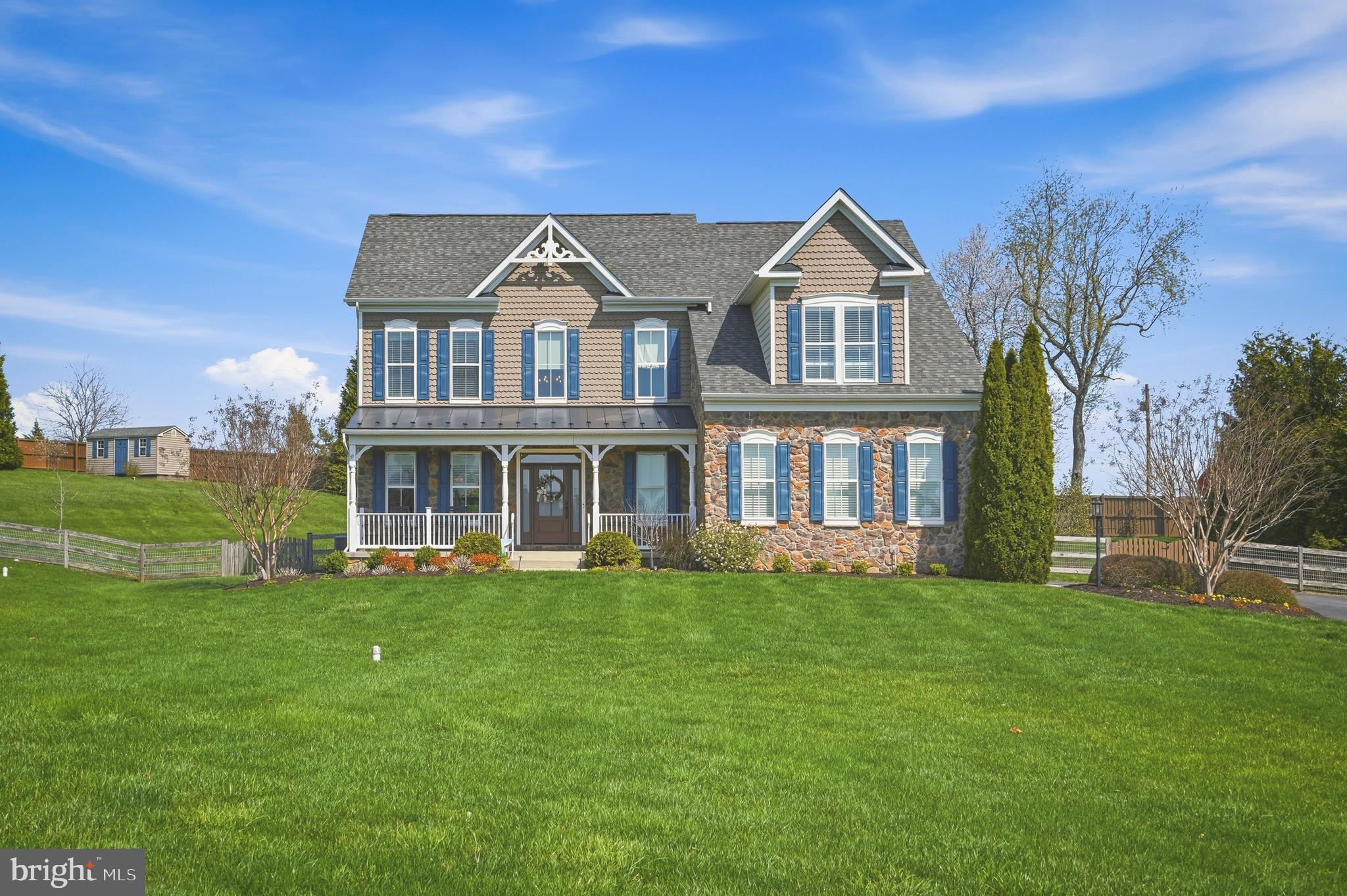 GORGEOUS 4 Bedroom 3 FULL and 1 Half Bath COLONIAL with a COVERED Front Porch in Westminster * Features Include: STUNNING 2 story foyer * Living Room * Dining Room * Large  FAMILY room with a stacked stone GAS fireplace and coffered ceiling * SPACIOUS kitchen with GRANITE countertops, backsplash, center island/breakfast bar, stainless steel appliances including the NEW double wall oven, dishwasher and refrigerator * SUN FILLED breakfast room with a cathedral ceiling * GLEAMING hardwood floors * Half bath * Newer carpet and lighting * The UPPER level offers a PRIMARY suite with a HUGE walk in closet and luxurious bath, THREE additional bedrooms and a FULL bath * On the LOWER level you will find an expansive rec room, exercise room/office, FULL bath and walkout to the FENCED yard  with mature landscaping, a STONE  hardscape patio with lighting, fire pit and AMAZING views * TWO car side entry garage with MULTI car driveway * This home has been meticulously maintained, SHOWS LIKE A MODEL, and cannot be missed!!