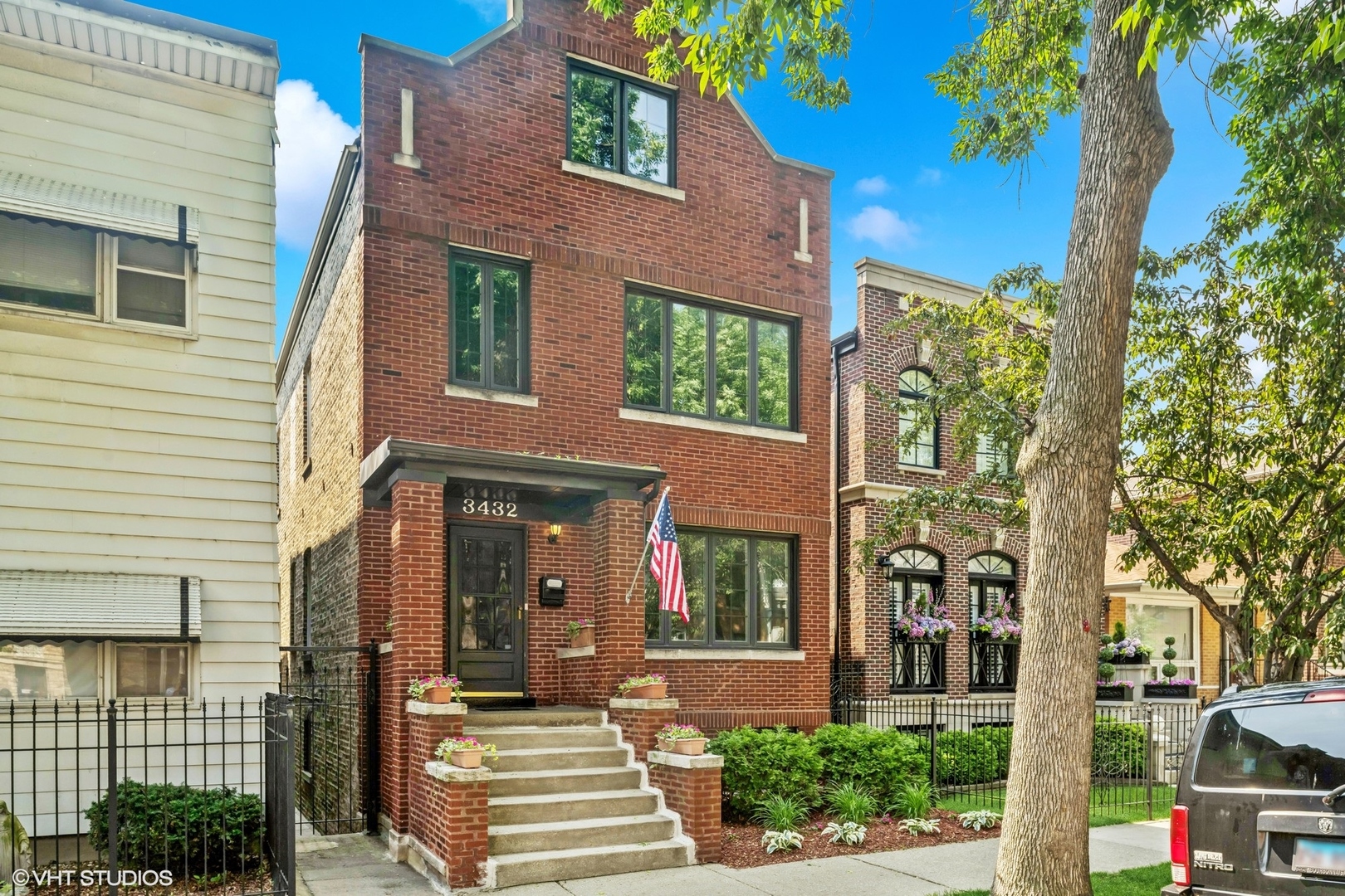This classic Chicago-style brick home blends timeless architecture with a classic Bridgeport location. Recently tuck pointed on the north and south sides of the building and featuring fully enclosed back porches, this property is zoned as a two-family residence but currently functions as a spacious single-family home-offering versatility for future use or investment.  Inside, the main level boasts a spacious kitchen with an eat-in area, custom banquette seating, built-in desk, and a large walk-in pantry. A convenient mudroom off the kitchen leads to a generous deck-perfect for outdoor entertaining-alongside a private backyard with patio space and a 2-car garage. The first floor also includes a full bath, cozy den, and flexible living spaces.  Upstairs, the second floor features a secondary living area, two bedrooms, and a full bath. The primary suite includes a large walk-in closet and a separate sitting area, offering a quiet retreat. The third floor adds two additional bedrooms, ideal for guests, home offices, or playrooms.  Split mechanicals offer efficiency and peace of mind: two furnaces, two A/C units, dual electrical panels, and two brand-new water heaters (2024). Whether you're seeking room to grow or multi-unit potential, this home delivers unmatched space and character in a classic Chicago footprint.