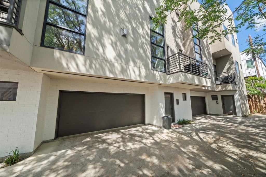 This thoughtfully updated 2-bedroom, 2.5-bath urban residence with a dedicated Office Space blends modern style with everyday comfort. Large floor-to-ceiling windows flood the home with natural light, enhancing the clean, contemporary feel. The kitchen has been tastefully redesigned with quartzite countertops, a white oak island with a waterfall edge, stainless steel appliances, a wine fridge, and refreshed cabinetry with updated hardware. It opens directly into a spacious living area centered around a gas fireplace. The primary bathroom has been recently renovated and features new tile flooring and a fully updated shower. White oak hardwood floors run throughout the home, adding warmth and a refined finish. Located in a sought-after area with close proximity to popular destinations, including Knox-Henderson and Lower Greenville, offering a variety of dining, shopping, and entertainment options. Step outside to a rooftop terrace with sweeping downtown views—ideal for entertaining or unwinding. The gated backyard offers additional outdoor space, perfect for pets or relaxing.