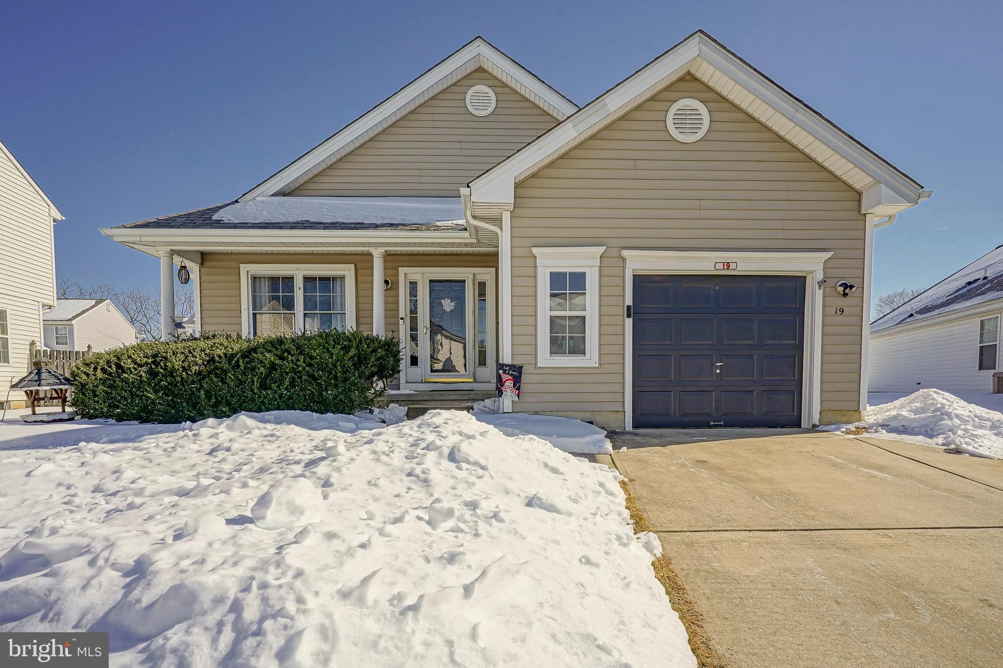 Welcome To 19 Bentwood Drive - A Charming 2 Bed, 2 Bath Rancher In Spring Meadow.  With Vaulted Ceilings, Bright Natural Light Beaming In From An Abundance Of Windows, And A Neutral Paint Palette, You Will Be Pleasantly Surprised By How Large This Home Feels!  A Convenient Double Driveway And Adorable Front Porch Greet You. Upon Entering, You'l Find The Oversized Living Room That Is Both Cozy And Functional. Step Down Into The  Eat In Kitchen And Breakfast Room, Which Offers Access To The Nicely Sized Fenced In Yard For All Your Outdoor Entertaining Needs. Down The Hall Is The Primary Bedroom Featuring Vaulted Ceilings, A Large Walk In Closet Plus Additional Linen Closet, And A Stunning Renovated Ensuite Bath. This Showstopper Offers A Luxurious Feel With Its High Ceilings,  Stylish Tile Lined Shower And Floors, And Dual Sinks Atop A Beautiful Vanity.  A Generously Sized Second Bedroom Serviced By An Updated Hall Bath And Laundry Complete The Main Floor. Downstairs You'll Enjoy Additional Living Space In The  Large, Finished Basement Ideal For A Play Room, Home Office, Or Other Endless Opportunities. Additional Highlights Include 1 Car Garage, Newer Roof (2020),  And Newer Hot Water Heater (2020). Don't Miss Out On This Comfortable And Welcoming Home That’s Ready For Everyday Living And Making Memories.