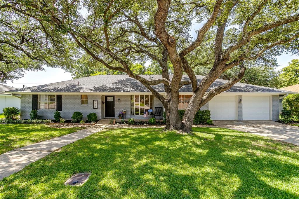 Welcome to this beautifully reimagined 4-bedroom, 2.5-bath home on a spacious lot in highly sought-after Wedgwood East. Framed by towering mature oak trees and showcasing incredible curb appeal, this home blends timeless character with extensive modern updates. Designed for both everyday living and entertaining, the flexible floor plan features two spacious living areas, two dining spaces, and a sunroom filled with natural light thanks to brand-new windows overlooking the lush backyard. Whether enjoying your morning coffee or hosting family and friends, this bright, inviting space is sure to become a favorite. The split fourth bedroom, located just off the laundry room, offers custom built-ins and exceptional privacy, making it an ideal home office, guest room, playroom, or hobby space. The fully renovated kitchen is the heart of the home, featuring new cabinetry, updated hardware, a stylish backsplash, high-end granite countertops, and updated lighting. Additional interior improvements include fresh paint, new flooring throughout most of the home, updated bathroom lighting and mirrors, a new dining room chandelier, new breakfast nook lighting, and a beautifully updated German schmear wood-burning fireplace. Major improvements provide peace of mind, including repaired foundation with a transferable lifetime warranty, completely upgraded plumbing with a 10-year warranty on materials and labor, and a brand new roof with gutters has just been installed! Additional updates include a new privacy fence, refreshed landscaping, new laundry room tile, and new sunroom windows. Offering generous living space, quality updates, and major system improvements in one of Fort Worth's most established neighborhoods, this move-in-ready home is the perfect blend of charm, function, and value. Conveniently located near shopping, dining, parks, and major commuting routes.