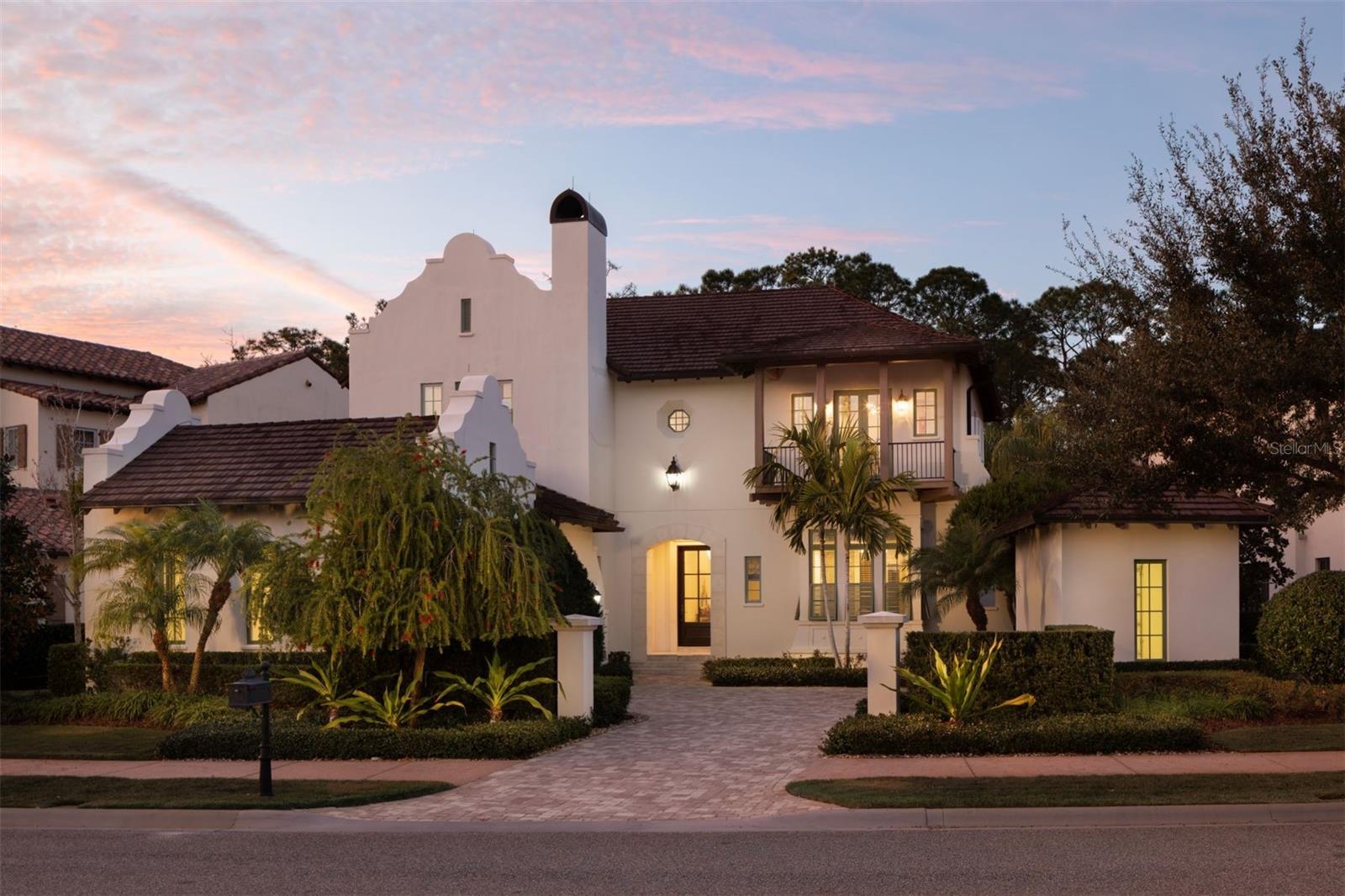 Welcome to Piedmont, a masterfully crafted residence that blends timeless architecture with breezy island flair. Built in 2016 by Issa Homes, this two-story residence offers 4,244 square feet of beautifully designed indoor living space, with a light and bright aesthetic and playful Disney touches throughout. A well-appointed kitchen with a generous island serves as the heart of the home, ideal for both everyday living and entertaining. The kitchen flows seamlessly into a spacious great room that opens to the outdoor living area, creating a true indoor-outdoor lifestyle. The home features five spacious bedrooms—each with its own ensuite bath—plus two additional half baths. On the main level, you'll find two bedrooms, including the luxurious primary suite, a serene retreat featuring a spa-style bathroom with a soaking tub and elegant finishes. Upstairs, three additional bedrooms surround a versatile multi-purpose room. Step outside to take in serene conservation views from your private outdoor oasis, complete with a sparkling pool, relaxing spa, summer kitchen and a cozy fireplace. Additional highlights include  two garage spaces plus a separate golf cart garage space, offering ample storage and convenience. Furnishings available for an additional $100,000; exclusions apply. Not included in the list price. Golden Oak at Walt Disney World® Resort is a residential resort community where families can live in the embrace of luxury, privacy and the magic of Disney. This gated community features distinctive neighborhoods of magnificent homes, expansive natural preserves and inviting amenities—including access to Golden Oak’s private clubhouse, Summerhouse, with superb food offerings served in a casually elegant dining room, courtyards, pool area, fitness facilities, and family room.  In addition, residents have access to Club Life, Your Special Connection to the Magic, including access to the Golden Oak Member Services team, park transportation, signature club events, theme park experiences, Extra Magic Hours and much, much, more.  Also at Golden Oak is Four Seasons Resort Orlando at Walt Disney World Resort, which hosts an 18-hole Tranquilo golf course, full-service spa, meeting facilities, and superlative restaurants.