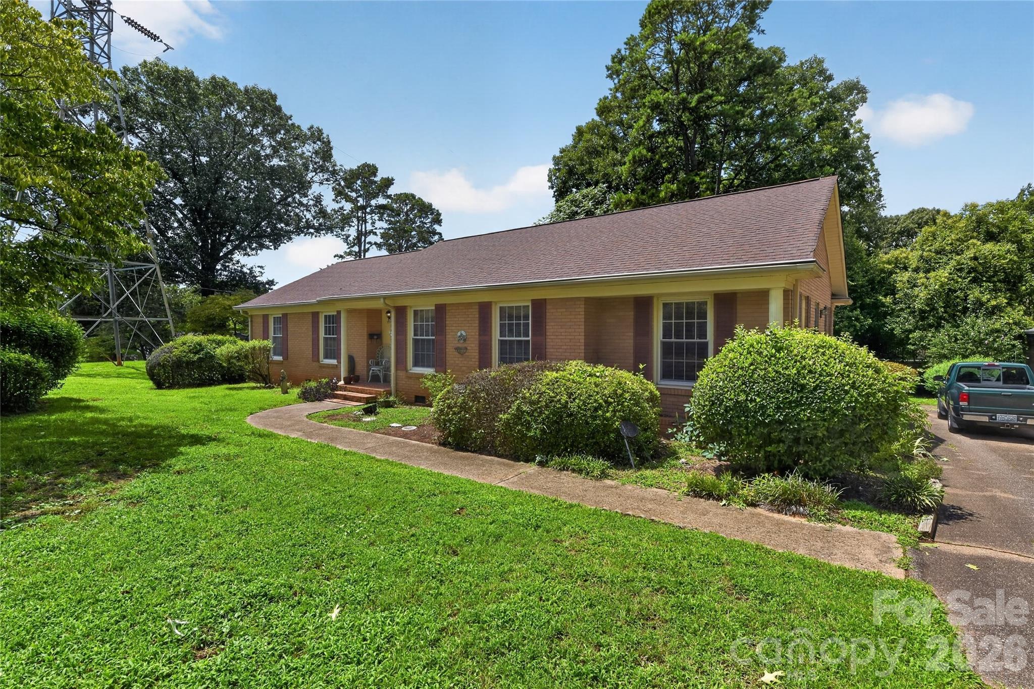 Welcome home to this classic, full-brick ranch nestled in Gastonia’s highly desirable Kingswood community! Featuring an ideal single-level layout, this beautifully maintained home offers 3 spacious bedrooms and 2 full bathrooms. The expansive floor plan boasts both a formal living room and formal dining room, plus a separate formal family room with fire place perfect for relaxed gatherings. Start your mornings sipping coffee on the charming front porch, or head out back to the private backyard with concrete patio—perfect for hosting weekend barbecues and enjoying outdoor relaxation. Combining timeless brick durability with a fantastic location near local dining, shopping, and major highways, this property is a rare find. Schedule your tour today!