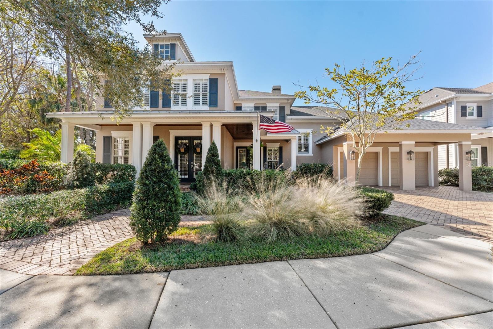 Beyond the GATED entry, a picturesque park-like setting frames this beautifully designed home, where manicured landscaping and mature trees create a serene sense of arrival. A clay brick driveway and matching walkway lead to the inviting covered front porch with a wood plank ceiling, while classic columns and lush greenery enhance the home’s timeless curb appeal. The elegant glass-paneled front door completes the welcoming entry, setting the tone for the refined living that awaits inside.Built in 2006 by David Weekley Homes, this 2-story pool residence offers 5 bedrooms, 3.5 baths, a 3-car tandem garage, and 4,018 sq ft of thoughtfully designed living space. The home is ideally positioned on an oversized 0.29-acre lot beside a park, with only five homes on a cul-de-sac street and natural preserve views across the street and a premier setting on scenic 64-acre Galt Lake.Inside, refined architectural details elevate the home’s timeless design. French doors open to a private office just off the foyer, while tray ceilings, crown molding, board-and-batten accent walls, and decorative columns add depth and character throughout. Wide-plank luxury vinyl flooring (2023) flows across the first floor, enhancing both style and durability. The great room serves as a stunning focal point with plank board ceilings and a wood-burning fireplace featuring a marble surround and mantle. A striking staircase with contrasting wood treads, crisp white balustrade, and wood handrail leads to the upstairs open loft and additional bedrooms, creating a graceful connection between levels.Designed for effortless entertaining, the chef’s kitchen showcases 42-inch raised-panel cabinetry with trim and crown molding, under-cabinet lighting, and a timeless tile backsplash. Leather look natural stone countertops and a spacious counter-height breakfast bar with pendant lighting invite gathering. Culinary highlights include a gas cooktop and premium stainless appliances including a Sub-Zero refrigerator, while a window above the stainless sink captures peaceful park views. A built-in bar area with wine refrigerator, glass-front cabinets, and generous eat-in space complete the space.The first-floor primary suite is a private retreat featuring a bay window sitting area, tray ceiling with crown molding, and recessed lighting. The ensuite spa bath offers a freestanding soaking tub, seamless glass walk-in tiled shower, separate vanities, a private water closet, linen closet, and an expansive walk-in closet.The outdoor living space is exceptional, featuring a brick paver lanai with wood plank ceiling, heated saltwater pool, and a NEW screen enclosure (2025) with three exits. An expanded paver patio, gas firepit, and pony walls with gas lantern lighting create an unforgettable setting for evenings by the water.Residents of Highland Park enjoy an elevated, resort-style lifestyle with a lakeside clubhouse, zero-entry pool, fitness center, playgrounds, and fishing pier on 64-acre Galt Lake, ideal for canoeing and kayaking. The community is zoned for A-rated schools, features an on-site preschool, and offers a charming retail village with walkable dining, wine bars, wellness studios, and boutique services. Ideally located near Tampa International Airport, Downtown Tampa, and Florida’s world-renowned Gulf beaches, this is luxury living defined by lifestyle and location. Schedule your private tour today and experience it firsthand.