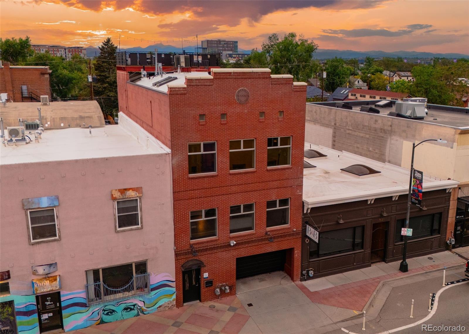 COMING SOON on 6/4. ALL PHOTOS TO BE UPLOADED 6/4. Join us for an OPEN HOUSE during the Art Walk on Friday 6/5 from 4-8:30pm. Two distinct spaces, a rooftop with unobstructed mountain and city views, and an industrial feel that actually fits the Santa Fe Art District. This live/work property was built for someone who wants their creative life and home life connected - and separate when needed.One unit works naturally as a gallery, studio, office, or client-facing workspace, while the second becomes a private living space above the energy of the neighborhood. Tall ceilings, oversized windows, and east-facing light give the interiors an open, airy feel throughout the day. The 300-square-foot mezzanine loft adds another layer of flexible space and leads directly to the rooftop deck with wide-open 360-degree city and mountain views that are hard to find this close to downtown.The industrial/creative design feels intentional here - clean lines, raw materials, and a space that lends itself to art, photography, design, or creative business use. And with no HOA, there’s more flexibility in how the property can function over time, including potential income or investment opportunities.Located in Denver’s Santa Fe Art District, you’re surrounded by galleries, coffee shops, breweries, restaurants, and the monthly art walks that make this one of the city’s most established creative neighborhoods. The attached two-car garage with alley access adds practicality that’s rare for this kind of urban live/work space.For buyers looking for something beyond a standard condo or townhouse, this property offers a setup that’s difficult to duplicate. Contact listing agent for a list of home features, floorplans, or to schedule a private showing. Home has been pre-inspected.