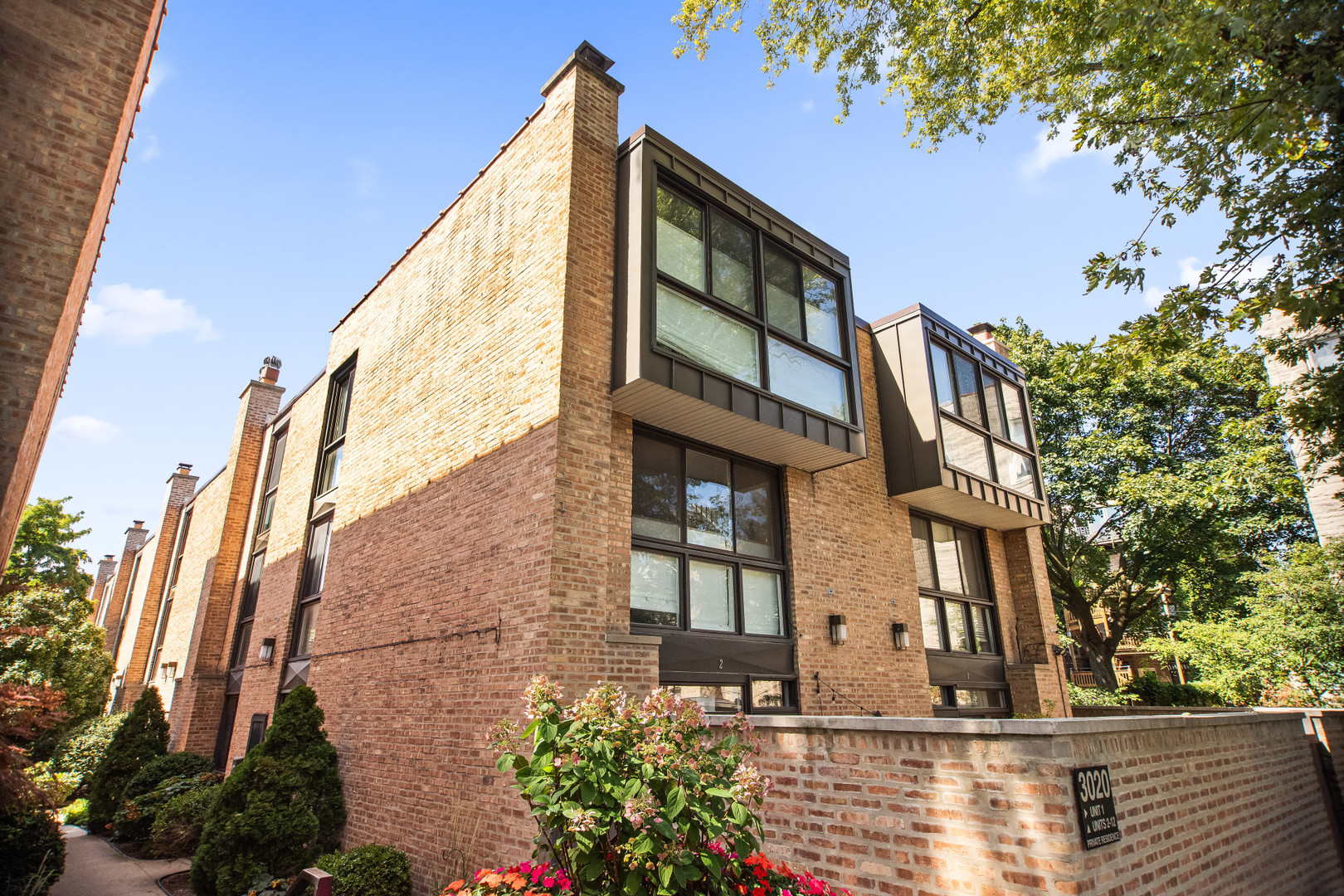Urban living at it's finest. Updated 3 bedroom +den/family room townhome on quiet street in coveted Nettlehorst school district. Abundant natural light from floor to ceiling windows throughout.  The first level features a wood burning fireplace, spacious living room/dining room combo, a nice size kitchen and sliding doors that open to a newly redone, private patio. The second level features a large bedroom, a full bathroom with walk in shower, and a family room/den. with built in bookshelves and desk .On the top floor you'll find a large primary bedroom, a third bedroom and a full, newly redone bathroom with walk in shower and a double sik granite vanity. Skylights add to more natural light, There are hardwood floors throughout, professionally organized closets and built ins add to appeal. In unit washer and dryer on second floor and one outdoor parking space included in price. Great city living within steps to Mariano's, shops, restaurants, cafes and a dog park. Easy transportation nearby. Don't miss this opportunity!