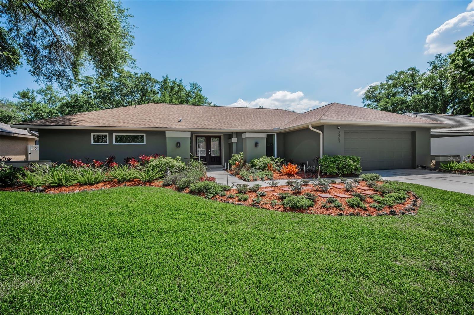 Look no further—this spectacular, meticulously maintained home offers the perfect blend of comfort, style, and functionality. Designed with an open floor plan, it’s ideal for entertaining guests or enjoying everyday family living. From the moment you step through the elegant double-door entrance, you’re welcomed by a bright, airy interior filled with natural light and sleek tile flooring throughout.The thoughtfully designed split floor plan provides both privacy and convenience. The spacious kitchen features beautiful granite countertops, solid wood cabinetry, a pantry with pull-out shelves, and newer appliances, including double ovens (2024), microwave (2024), double-door refrigerator, and dishwasher. Adjacent to the kitchen is a large eat-in area overlooking the pool, with additional sliders that seamlessly connect indoor and outdoor living. A separate formal dining room offers even more space for gatherings and entertaining.The expansive primary suite is a true retreat, complete with a fully remodeled (2023) spa-like bathroom featuring double sinks, a modern soaking tub, walk-in shower, and a private water closet with bidet. The bathroom is finished with Brazilian granite countertops and soft-close cabinetry. The suite also boasts a huge walk-in closet, offering ample space for storage and organization.Step outside through high-impact hurricane sliders to your own private backyard oasis. The beautifully landscaped pool area is both tranquil and inviting, showcasing stunning pool pavers along with a combination heating and cooling system and a pool vacuum—perfect for year-round enjoyment. The patio is also pre-plumbed for an outdoor kitchen, offering the opportunity to create the ultimate outdoor entertaining space.The secondary bathroom serves as both a guest and pool bath, with updated countertops and a walk-in shower. Two additional generously sized bedrooms are tucked away on the opposite side of the home for added privacy.Additional highlights include a laundry room with a utility sink and extra storage, plus a versatile closet that can be used as a pantry or utility space.This home truly has it all—style, space, and thoughtful upgrades throughout.