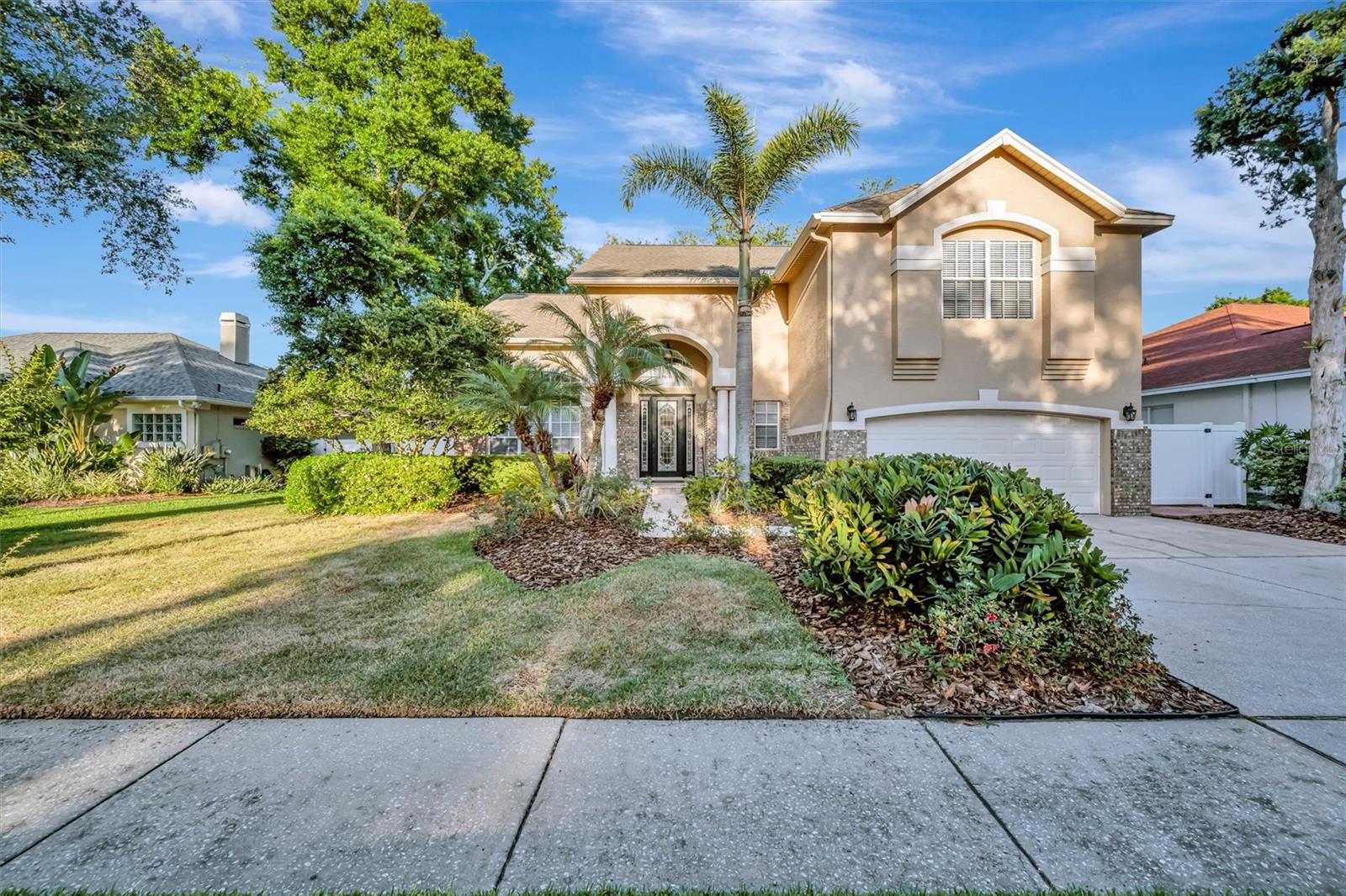 Welcome to this beautifully maintained 5-bedroom, 3.5-bath home offering 3,208 sq ft of living space. Built in 1994, this home features fresh interior paint, soaring ceilings, and a bright, open floor plan ideal for everyday living and entertaining. One of the upstairs rooms includes a private sink, offering added flexibility for guests, a home office, or bonus space. Enjoy the convenience of a spacious 2-car garage, all located within a desirable gated community featuring picturesque canopy tree-lined streets that create a charming and inviting neighborhood atmosphere. This exceptional home combines comfort, space, and curb appeal in a sought-after setting.