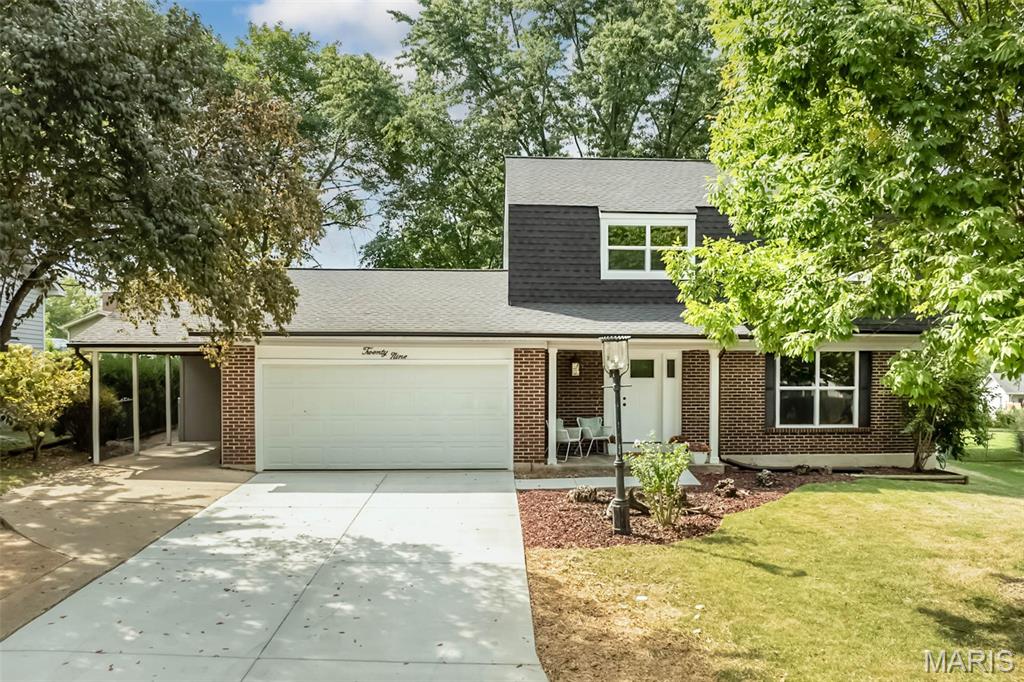 This home is a show stopper, a must see inside! Fresh, stylish and beautifully renovated 4-bedroom, 2.5-bath St. Peters two-story. Step inside to a bright, neutral interior with new engineered wood flooring, baseboards, doors and fresh paint throughout. The updated kitchen steals the show with new cabinetry, sleek hardware, subway tile backsplash, new sink and stainless appliances, while multiple dining and living spaces provide plenty of room to spread out and entertain. Just beyond the kitchen, the inviting family room features a shiplap-accented fireplace, while the light-filled sunroom adds another special gathering space with a beautiful wood-plank ceiling and backyard views. Convenient main floor laundry.Upstairs, you'll find four bedrooms, including a primary suite with private full bath with beautiful tiled shower and black shower door.  The updated full hall bath also has beautiful tiled shower. Ceiling fans in 3 of the bedrooms. Unfinished basement offers additional space that could be finished. Major improvements go well beyond the cosmetic and include a new roof, windows, exterior doors, gutters and driveway. Outside, the spacious, tree-lined backyard offers mature landscaping, patio spaces and plenty of room to relax, play or entertain. Yard is fully fenced and already has a firepit area ready for fall fires and smores! Attached two car garage as well as additional parking with the one car carport. Plenty of storage outside with attached storage shed behind the carport and a detached shed in the backyard. Conveniently located in the heart of St. Peters near shopping, dining, parks and recreation. Spencer Creek Park just around the corner!
