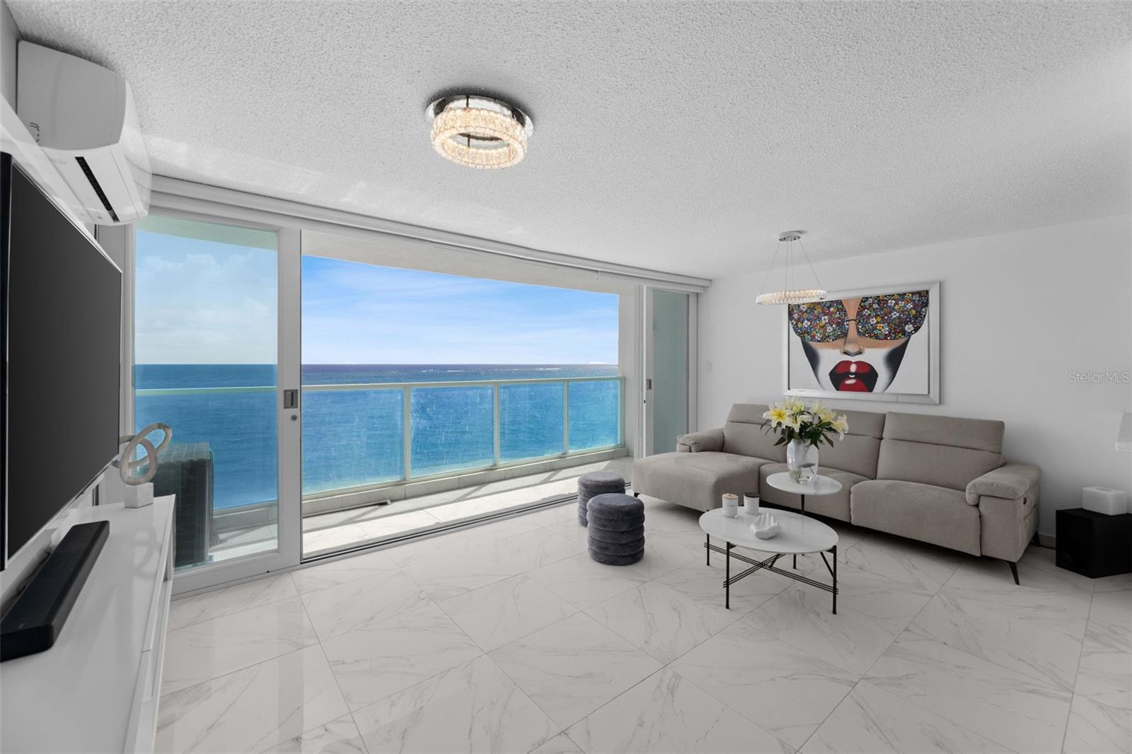 All about views in this stunning ocean front, beautifully renovated condo with breathtaking 180-degree views. This abode has an abundance of natural light and cross ventilation, with floor-to-ceiling windows that frame the ocean view. The 1 Bed/1 Bath, 720 SF home has an open kitchen concept with stainless steel appliances, a smartly laid out living space and a balcony. The unit features a bright, airy look with white and light gray tones throughout, marble-look porcelain tile flooring, and sleek, updated finishes. The primary bedroom offers a spacious walk-in closet, and the bathroom was tastefully appointed with contemporary fixtures. Offered turn-key and fully furnished.Mirador del Condado is a 13 story oceanfront condominium directly on Ashford Avenue, offering 24 hour security and a swimming pool. Enjoy the perks of urban island living, walk to great shops, the beach, the best entertainment and restaurants, parks and all that the city has to offer.