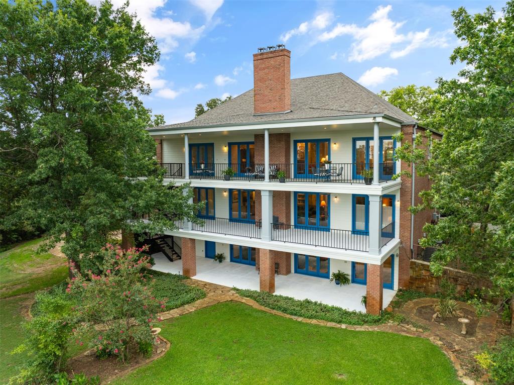 Discover the epitome of sophisticated living at this exceptional Lake Texoma estate, nestled within a prestigious gated community in Pottsboro, TX. This luxurious home, boasting six bedrooms, offers unparalleled versatility for a transgenerational living experience or the perfect private retreat.

Spread over three expansive levels, this Georgian architectural gem features three distinct kitchens, making hosting gatherings a breeze across its vast layout. With six bedrooms equipped with their own ensuite baths, privacy and convenience are guaranteed for all inhabitants and guests. The primary suite is a sanctuary in itself, complete with separate his and her baths and closets, providing an oasis of tranquility and indulgence.

Enjoy breath-taking lake views from two of the three private balconies, perfect for savoring serene sunrises or hosting intimate social gatherings. Inside, three grand fireplaces provide warmth and ambiance, making this home ideal for both winter relaxation and festive celebrations.

Set on over an acre of meticulously landscaped grounds, this estate invites you to wander through park-like settings and view the abundant wild life. A private trail leads directly to a sandy beach. Create timeless memories with loved ones by the water's edge or embark on aquatic adventures with ease.

Conveniently located off Preston Road (Highway 289), the property offers easy access to local dining and shopping, without the challenge of winding roads. The proximity to upcoming entertainment hubs like Margaritaville and Hard Rock Casino positions this home not only as a luxurious residence but also as a promising investment in an area poised for significant growth.

This rare opportunity to own a slice of prime lakeside luxury awaits whoever desires a haven of elegance and the vibrant life Lake Texoma promises. Experience the unparalleled allure of lake living and secure your future in this one-of-a-kind property.