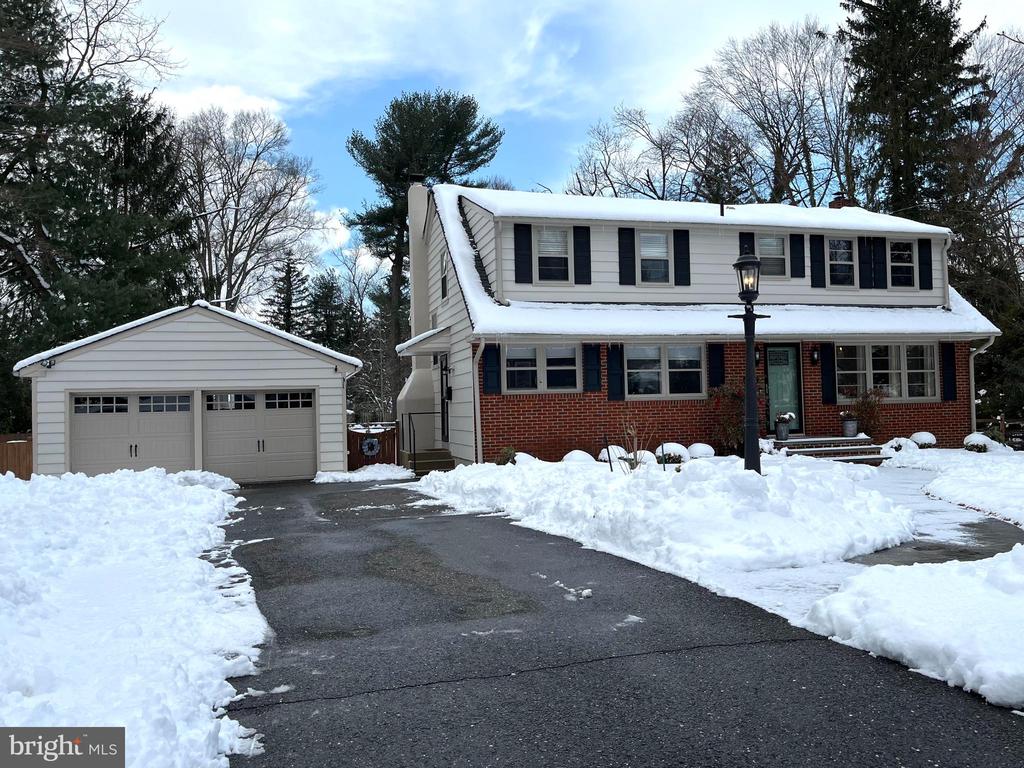 Open House 3/1/26  1-3...Supberb Location...Welcome to this multi-level 4 bedroom home  with updated kitchen and baths and enjoys a huge backyard on a 1/2 ac lot!  Imagine putting in a Pool or Tennis Court! This home has a large bright living room accented with stained Oak Floors that continue up to the bedrooms.  Adjacent to the living room is an Updated Kitchen and Breakfast nook framed  by windows to watch the kids walk to school.Just steps down and you're in a comfortable family room with a door that opens to an enormous back yard and  patio to enjoy  sipping a cup of coffee or evening cocktail while taking in the  peaceful views. Back inside find a large laundry room with  a charming  half bath....don't miss what's behind the little  door, could be a wine cellar or as the sellers now use it for additional storage! The oversized 2 car garage is large enough to  hold 2 cars plus room for storage, a fridge and a large work bench (bench stays).  The heater is aprx. 2 yr,  AC is aprx. 2+yr old,  the roof was treated with "ROOF MAXX ".  Walk to Town Center, Library, Schools and the Holiday Parade... A truly wonderful town to live in for years! NOTE: Some photos have been virtually staged for your imagination .