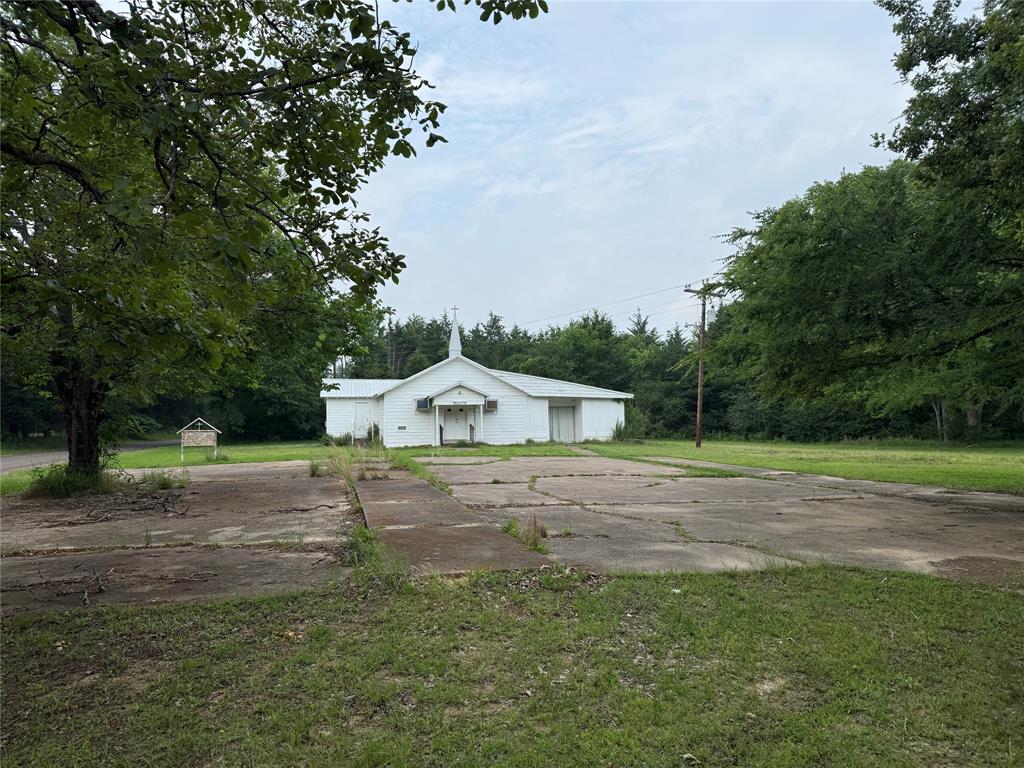 Take a look at this 15-acre CORNER lot with power and water meter already available! You'll appreciate the beautiful, majestic oaks and trees on a mostly wooded tract surrounded by lots of neighboring farms. Bring your house plans to build with plenty of options for the perfect spot. With lots of road frontage, choose your new driveway on the the south or east with 530 feet on the south side and 530 feet on the east side. An old church building, originally built in 1940 (with unknown condition), is also on property. You'll find No FEMA or pipelines on site. Create your dream home in a quiet country setting while minutes to all the city amenities in Sulphur Springs!