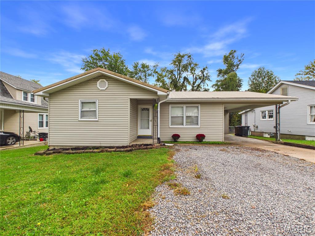 This 3-bedroom, 3-bathroom bungalow features vinyl siding, a carport with extra storage, a raised deck, and a fenced-in backyard.Interior upgrades include fresh paint and new flooring throughout. The renovated kitchen comes equipped with new cabinets, countertops, a refrigerator, dishwasher, range, and microwave hood. All three bathrooms have been fully remodeled with new showers, tubs, vanity cabinets, and flooring. The home also includes new panel doors and fresh carpet, with original hardwood floors beneath the carpet in the upstairs living room and bedrooms.The walk-out basement features one bedroom, a updated bathroom, a utility room with new cabinets and flooring, and a large storage room with shelving. It also includes a spacious den with a large walk-in closet, which could serve as a recreation room, office, or fourth bedroom.