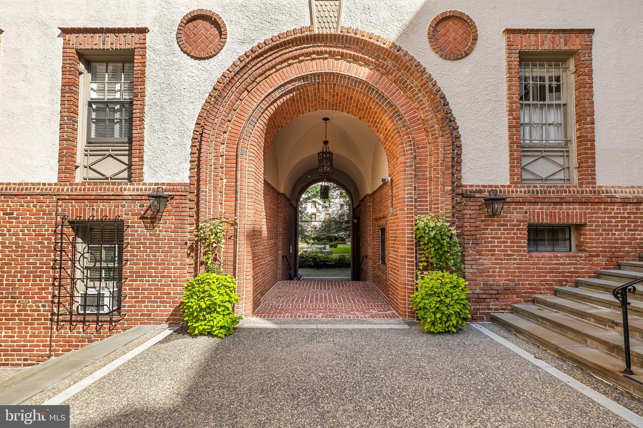 Come see this spacious and updated 3BR/2BA first floor condo located in the classic Roland Park Condominiums, designed by renowned architect Edward Palmer.  Offering  nearly 2,000 sq ft of living space, this classic and elegant home has high ceilings (9'+), large windows, crown molding, and hardwood floors throughout. The modern kitchen boasts granite countertops, stainless steel appliances, and large pantry. You’ll find ample space to entertain with a welcoming dining room and an elegant living room which features built-in bookshelves and a decorative fireplace. Don’t miss the two full bathrooms, one with a spacious walk-in shower and heated towel bar, and the other a Jack and Jill style. Additional highlights include an in-unit washer/dryer and three A/C wall-units (2 installed in 2025) - a rare find in this historic building.  Enjoy the convenience of one covered parking space, dedicated basement storage, and beautifully landscaped grounds. Prime location within walking distance to Petit Louis, Eddie’s of Roland Park, the library, and Hillside Park. Convenient access to I83 makes it easy to get downtown or up to the beltway. Condo fee includes heat, water, and exterior maintenance.