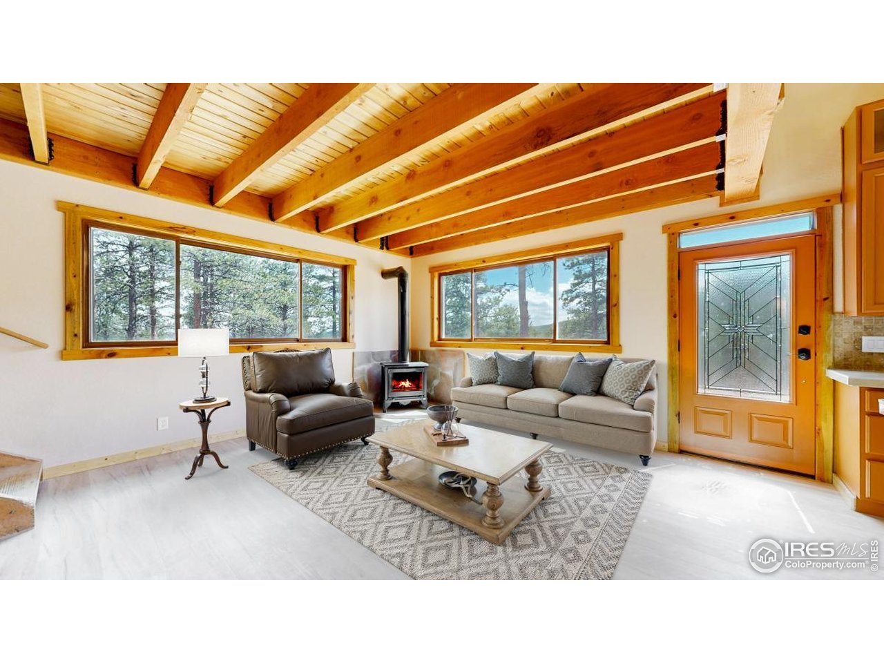 A "Rocky Mountain" Home Like No Other. This stunning 3-bedroom, 2-bathroom home isn't just a place to live; it's a destination. Nestled among towering pines and aspens, and surrounded by panoramic mountain views. This 9.45 acre property adjoining Roosevelt National Forest, has many flat and buildable spaces for outbuildings, gardens or even a horse barn. An oversized 2-car garage w/room for cars and toys and a large workshop or storage room, offers direct access to an endless array of outdoor adventures year-round. In summer, explore miles of hiking and biking trails that weave through wildflower meadows, aspen groves, and along mountain ridges with views that stretch for miles. Paddle or fish in nearby lakes, or spend the day rock climbing, trail running, ATVing, or horseback riding in the surrounding wilderness. World-class skiing, snowboarding, snowshoeing, and cross-country trails literally just out the door. Wildlife sightings are part of daily life here-elk, moose, foxes, and hummingbirds all make frequent appearances. If you're seeking full-time residence, seasonal home, or an investment property, its unbeatable combination of location, design, and access to outdoor recreation make it a rare opportunity for anyone who loves the mountains. The house boasts 400 Amp power service making it perfect for a wood worker, machinist or other specialized hobbyist. High-speed internet makes it easy to work remotely and stay connected. Live where others vacation. The expansive front porch invites you to take in the beauty that stretches in every direction. Inside, the home welcomes you with an open-concept design.