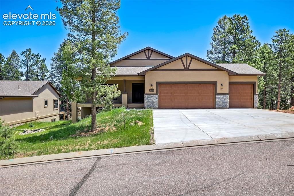 Fabulous new ranch style home in beautiful Evergreen Heights. Very custom features with low maintenance abound. Inviting 8x24 front porch calls to sit a spell. The richly stained front door opens to a lovely Great Room with corner gas log fireplace with rustic stone accents. The Dining area is adjacent to the spacious breakfast bar. The ample kitchen opens to the 10x20 deck for al fresco dining and outside grilling ease. The kitchen comes complete with 1951 Cabinetry, Maple-Latte stain, Solid surface granite counter tops, all high end, gourmet appliances that include the GE Cafe Smart Dual Fuel Range/Oven, GE Advantium Custom Oven, GE Cafe Warming Drawer, GE Cafe Energy Star Refrigerator, GE Cafe Energy Star Smart Ultra Fresh Dishwasher and Zephyr Ventilation Fan. The exterior door hardware is the Kwikset Smartlock system with a front door key pad entry.  The main level sports a large, bright primary bedroom with a huge walk in closet, a spa like bath, and even has an outlet should you want to install a heated toilet seat. There is an additional bedroom on this level with a large bright window and just around the corner from the lovely hall bath with neat title and granite counters. The laundry room opens to the oversized 3 car garage and is a great drop zone. The garage includes a hot and cold water faucet, to clean the pets or even dirty shoes from recreating.  The lower level has a huge walkout family room to a 10x20 patio, 2 large bedrooms, a full bath with dual vanities, one more unfinished basement bedroom, so this could be a 5 bedroom home and a storage area in the mechanical room. The state of the art heating system is a high efficiency hot water/forced air type system. This home also sports a Moen Flo water management system. The roof is an IR Level 4 hail resistant.  This is a Performance Rated Home designed with a HERS rating of 53, which can save $$ on utility bills. And it's located close to parks and hiking trails–true, lovely Colorado mountain living!!