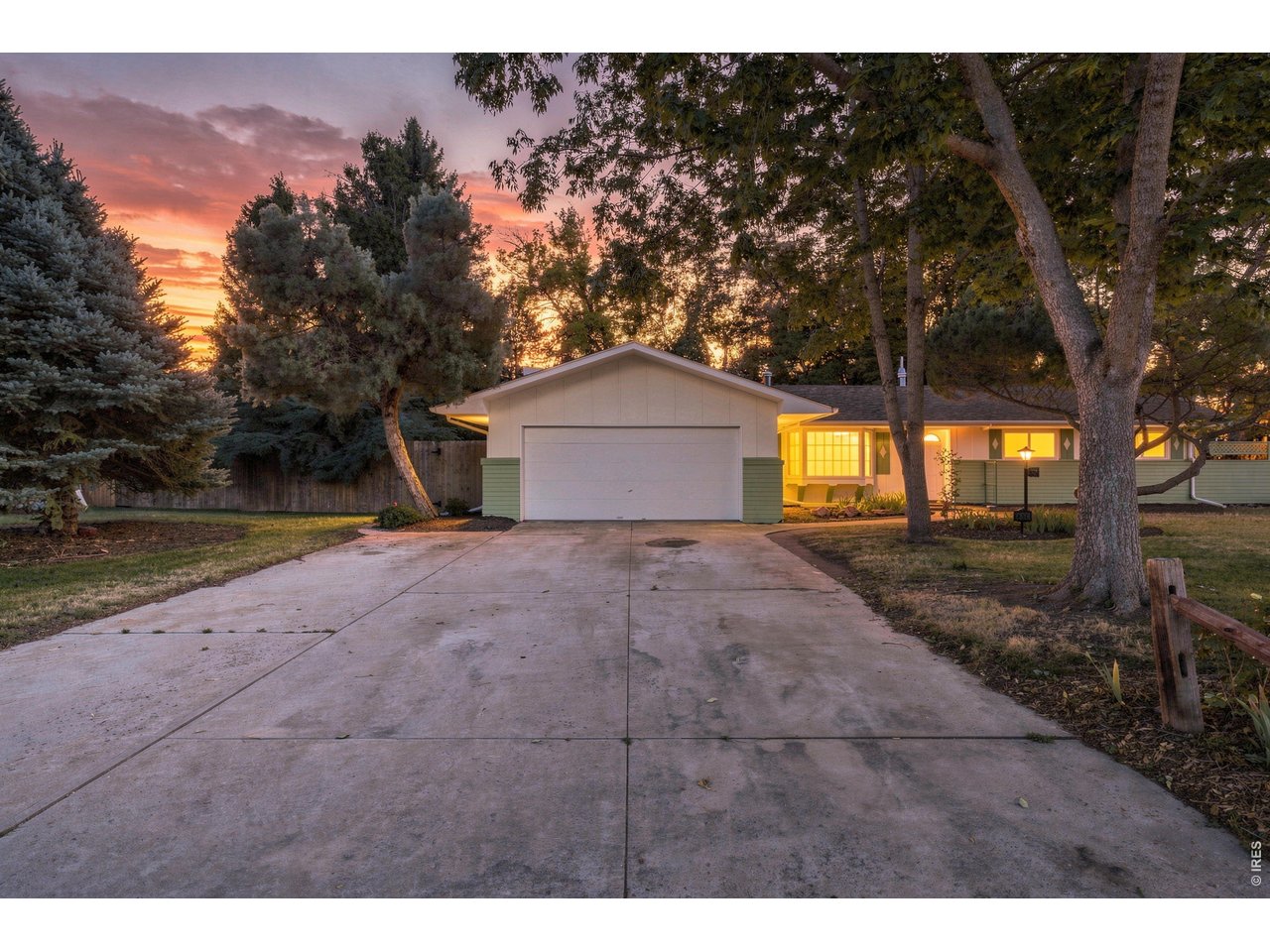 Peaceful, updated midcentury ranch in Old Town Fort Collins! Pre-inspected and thoughtfully improved, this home blends midcentury character with meaningful updates, three distinct living spaces, gorgeous new hardwood floors and a sprawling lot shaded by mature trees. A charming entry beside the bay window welcomes you into the large living room, where a cozy window seat creates the perfect spot for morning coffee or a good book. The family room is warm and full of character with hardwood floors, a beamed ceiling, cozy stone fireplace and built-in bookshelves ready for books, artwork and favorite collections. The spacious dining room offers room for a substantial table, while the nearby study features vaulted ceilings, a skylight, ceiling fan and French doors to the backyard. A separate sunroom creates yet another bright space to relax, work or entertain. The kitchen preserves its period personality with refinished wood cabinetry while adding new butcher block countertops, sink, double oven and vent hood, plus a gas range and tile backsplash. Retreat to the serene primary suite with vaulted ceilings, beautiful hardwood floors, two closets and wraparound windows overlooking the backyard. Outside, the newly refinished deck is ready for summer BBQs, morning coffee or evenings under the trees. The huge backyard offers room for yard games, gardens and outdoor living, with a path leading to an 8'x10' pad ready for a shed. Bring the toys, too - the extra-wide driveway provides RV and boat parking. The garage adds pull-down attic access, natural light, an opener, service door, bright new lighting and built-in storage, while crawl-space storage adds function. Significant updates include a new sewer line, fresh interior/exterior paint, new hardwood floors throughout and extensive kitchen improvements. Enjoy a peaceful central Fort Collins setting close to Old Town, CSU, local shops, dining, galleries and community events. Tour today and make your next move your best move.