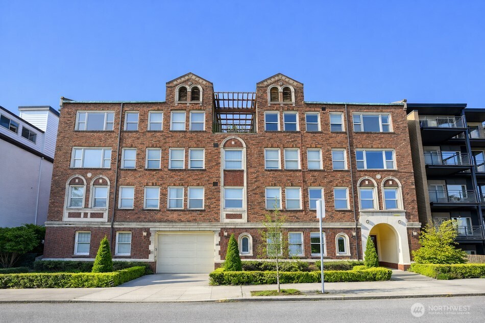 Trophy 23 unit apartment community on the coveted south slope of Queen Anne, offering iconic Downtown Seattle views. Located in a true “Walker’s Paradise” just steps from Climate Pledge Arena and Seattle Center, nearly half the units capture views of the Space Needle, Mount Rainier, and partial Elliott Bay.    Built in 1928, Ella Robert blends timeless architecture with thoughtful modernization. Over $1.1M has been invested in capital improvements, including updated electrical and plumbing systems, a 2020/2021 roof replacement, and a well maintained elevator, minimizing near term capital needs. The property features 14 secure sprinklered garage parking stalls, 20 on site storage units plus additional owner storage, and a private terraced courtyard with patio, turf, and garden areas, an uncommon amenity in this urban core setting.    17 of 23 units have been fully renovated, with 18 offering in unit laundry. Six units have partial updates, with plumbing already stubbed to streamline future renovations. A rare penthouse unit offers flexibility as a luxury owner’s pied à terre with income potential, previously utilized as a short term rental.    With below market rents and clear upside through continued upgrades, rent optimization, and expense efficiencies, Ella Robert presents a rare opportunity to steward a legacy asset in one of Seattle’s most sought after neighborhoods.