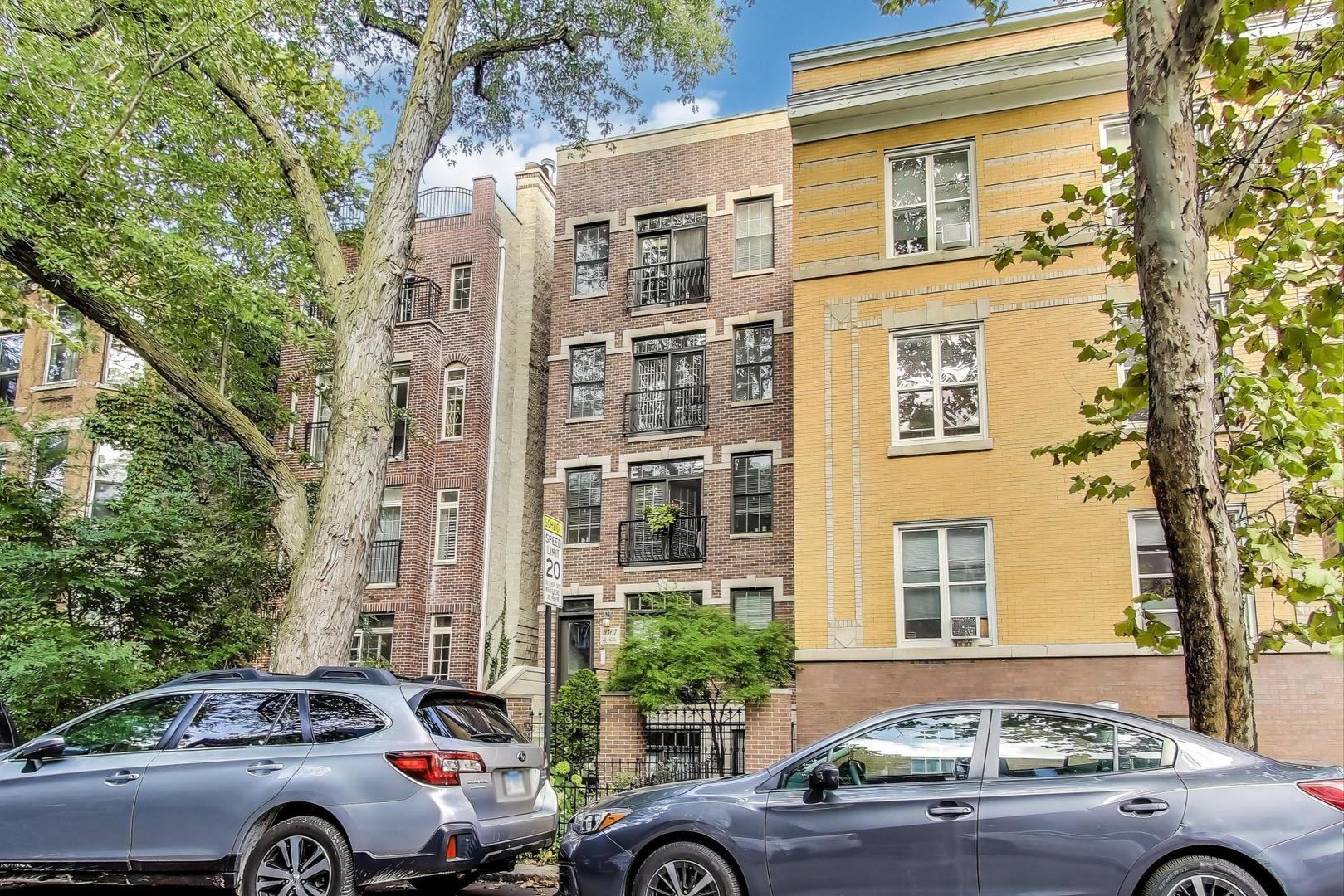 This alluring and spacious 2-bedroom, 2-bathroom condo is nestled in an all-brick building on a beautiful tree-lined street in East Lake View. Enter this bright 3rd-floor condo to recently refinished hardwood floors and freshly painted walls. The open kitchen and living room layout is perfect for hosting with a large granite peninsula, stainless steel appliances, and plenty of storage with a large walk-in closet and beautiful wooden kitchen cabinets. In the living room, you have a charming west-facing Juliet balcony and a cozy fireplace. Head down the hall to the sun-filled primary suite with a walk-in closet, a private balcony, and a spa-like bathroom with a double vanity sink and separate whirlpool and shower; the perfect retreat. Completing this unit is an additional full bathroom and bedroom, and an in-unit washer and dryer. A designated storage room can be found in the attached garage and one exterior designated parking space is located off the alley. And the location is unbeatable, a short distance from all of the restaurants, cafes, and nightlife Halsted & Clark street have to offer! Never miss a Cubs home game, with the 7 minute proximity to Wrigley Field or catch the red line and explore the city!