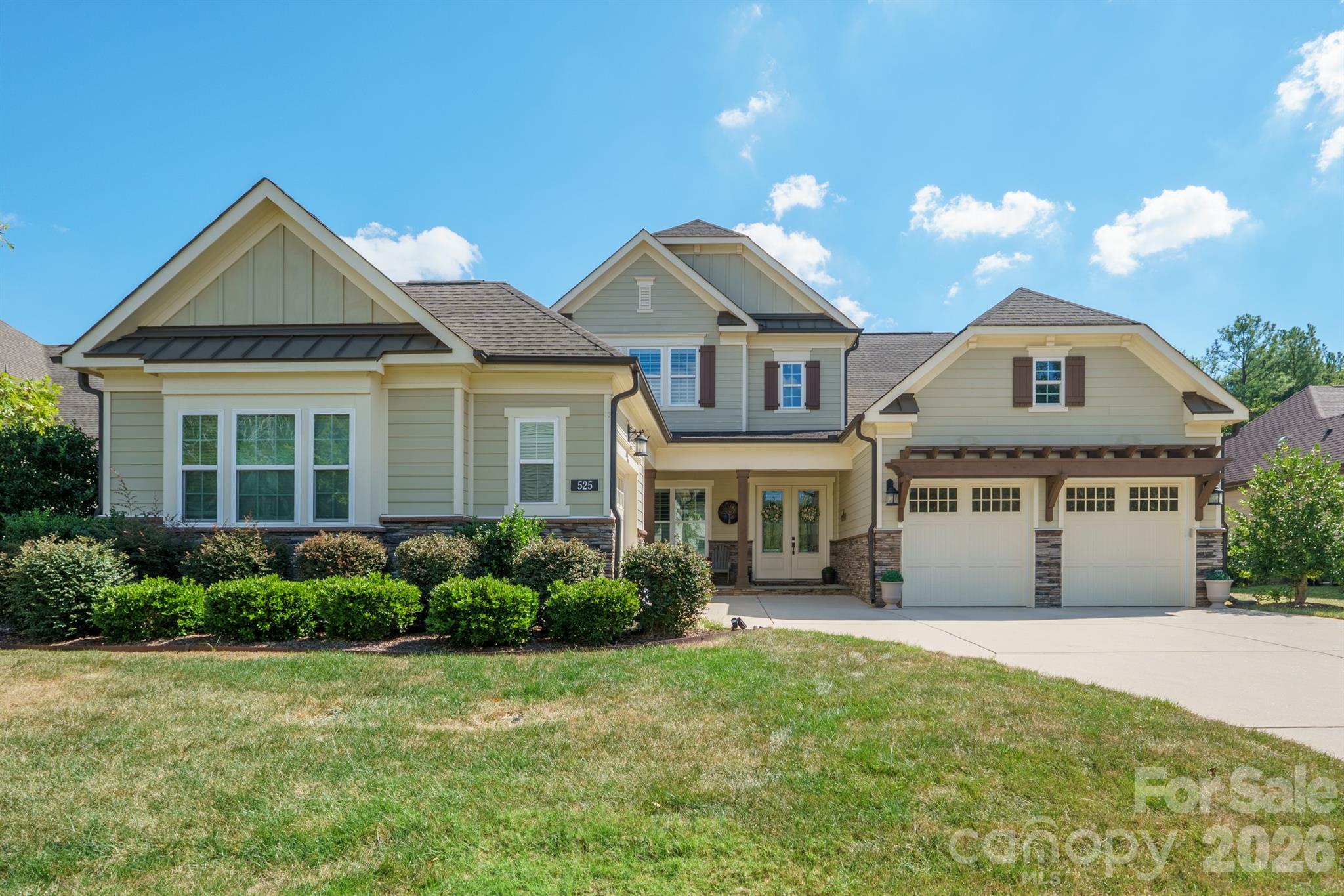 Welcome to 525 Vintage Creek, an exceptional Weddington home offering elevated finishes, thoughtful design, and outstanding indoor-outdoor living. Beautiful wood flooring flows throughout the main living areas, leading to a stunning kitchen featuring quartz countertops, stainless steel appliances, and an impressive walk-in pantry.The main level offers a highly desirable layout with both a guest suite and a spacious primary suite. The primary retreat features an exceptional bathroom and a generous walk-in closet. Upstairs, two additional bedrooms and a versatile loft provide flexible living space.Outdoor living shines in the premium private lot, fenced backyard, featuring a spacious patio, outdoor fireplace, and covered back porch—an ideal setting for entertaining and enjoying the peaceful surroundings. A covered front porch adds to the home's welcoming curb appeal.The impressive 3-car garage features a separate 2-car and 1-car configuration, offering excellent flexibility for parking and additional storage.Located in the desirable Vintage Creek community, residents enjoy a peaceful, walkable setting with sidewalks, wooded common areas, and a scenic community pond. Enjoy convenient access to Weddington Swim & Racquet Club, Siskey Sport Center, and Colonel Francis J. Beatty Park, a 265-acre destination featuring walking trails, playgrounds, tennis and basketball courts, soccer fields, and picnic areas. Excellent shopping, dining, and convenient access to I-485 are all nearby.A wonderful combination of refined finishes, exceptional outdoor living, thoughtful design, and a desirable Weddington location—525 Vintage Creek is a home that truly stands out.