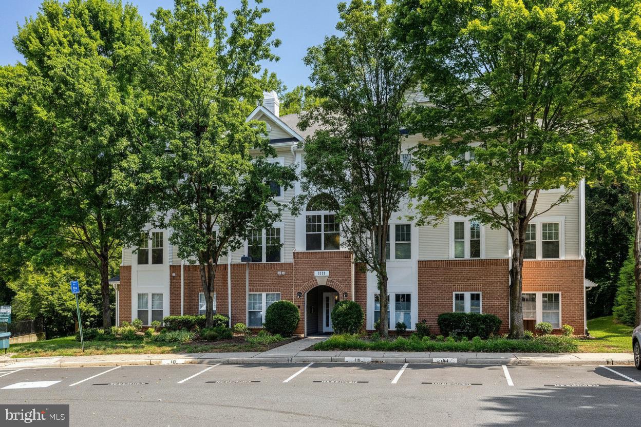 A rare 3 bedroom condo in the heart of North Reston, offering nearly 1,300 square feet of spacious one level living in a location that makes everyday life incredibly convenient.This open and light filled home features an abundance of windows with peaceful, tree lined views. Freshly painted throughout with newer LVP flooring, the home is truly turn key and ready for its next owner. The dedicated dining area includes custom built ins and opens to a private balcony, perfect for morning coffee or relaxing at the end of the day. The kitchen features granite countertops, a casual eating area and a recently replaced full size washer and dryer. The spacious primary suite includes a private bath and walk in closet, while two additional bedrooms offer plenty of flexibility for guests, a home office, workout space or whatever fits your lifestyle. A second full bath and generous closet space complete the home. The condo also includes one assigned parking space with additional guest parking available throughout the community. One of the best parts of living here is everything you can access right outside your door. North Point Village Center is within walking distance for Starbucks, groceries, dining and everyday errands. Beyond that, you have the full Reston lifestyle with miles of trails, lakes, pools, tennis and basketball courts, playgrounds, parks and a full calendar of community activities throughout the year. Reston Town Center is just minutes away for even more shopping, dining and entertainment. For commuters, the location is equally convenient with easy access to the Reston technology corridor, Metro, Route 267 and major commuter routes throughout Northern Virginia. Located in a secure building, this spacious 3 bedroom home offers the ease of low maintenance condo living with the space, amenities and lifestyle that make North Reston such a desirable place to call home.