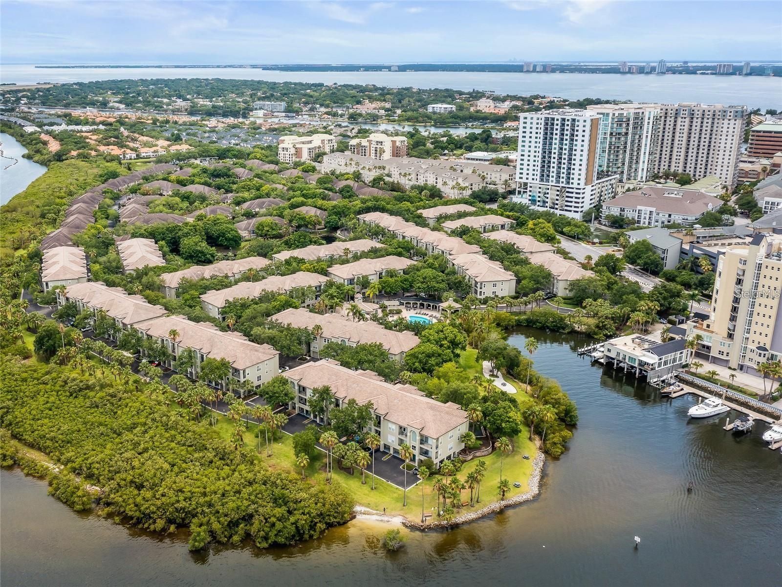 The Island Place Residences — a beautifully updated 1-bedroom, 1-bathroom, 1-car garage, townhome-style condo — is in the exclusive and prestigious Harbour Island community. This 24/7 guard-gated neighborhood is within walking distance of Amalie Arena, Sparkman Wharf, Water Street, Tampa Riverwalk, Publix, Channelside, and Downtown Tampa. It’s also just minutes from Ybor City and Armature Works, offering easy access to high-end restaurants and vibrant nightlife. This thoughtfully renovated end-unit townhome spans three stories and features 900 square feet of interior space filled with natural light. Highlights include soaring ceilings, an elegant kitchen with 42-inch wood cabinetry, luxury marble countertops and backsplash, stainless steel appliances, and rich cherry hardwood floors. Additional premium features include remote-controlled window shades, hurricane-rated PGT windows, and triple sliding glass doors leading to a spacious private balcony overlooking a picturesque waterfall and pond. The attached 1-car garage offers modern conveniences such as a washer and dryer, an overhead rafter, shelving for storage, and epoxy flooring for a clean, contemporary finish. The generous bedroom includes a custom walk-in closet, remote-controlled shades, a ceiling fan, and stylish barn doors for added charm. The luxurious bathroom showcases a walk-in shower, natural light from a window, beautifully tiled porcelain walls and flooring, and a defogging mirror cabinet. Residents of Island Place enjoy resort-style amenities, including a temperature-controlled pool, hot tub, tennis courts, a children’s playground, and a fully equipped fitness center. The pet-friendly complex also features BBQ grill areas, kayak water access, scenic walking paths, and two well-appointed clubhouses with Wi-Fi. A personal visit is essential to truly appreciate this remarkable residence's elegant waterfront lifestyle.
