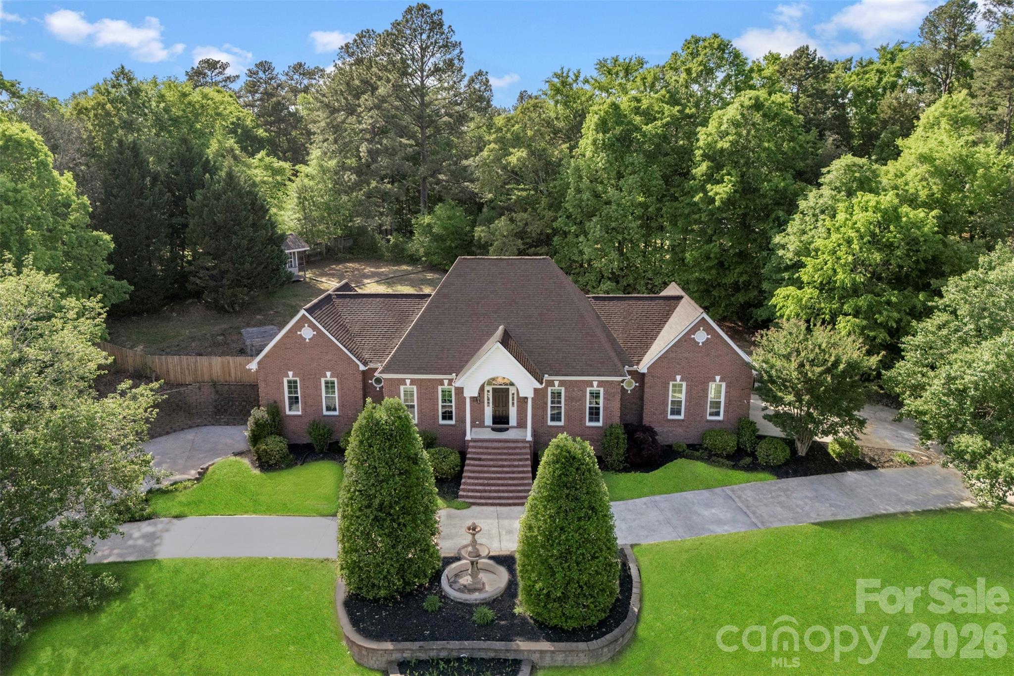 WOW!  What a rare find. This Elegant Custom Brick home has been loved by its original owner and is ready to be passed on to the you. Located on 1.69 AC, you have to see this property to fully comprehend all that it has to offer. The main level has a formal dining, family room with fireplace that overlooks the breakfast area and kitchen. The Kitchen has great cabinet space, corian countertops, SS appliances, tile backsplash and recess lighting. A laundry with mud sink, 2 spacious bedrooms. 1 Full bath.  In the primary ste, you will have a charming feel with  12 ft ceilings, a walk in closet, primary bath with dual vanity and sep garden tub and shower.Bonus room could be used as a bedroom as it has a nice walk in closet and book shelving.The walk out basement is almost wide open and ready for whatever you need-extra living space, a game room, home gym, a office or flex room, open studio, full bathroom, and plumbed for a possible wine bar.  The attached single garage adds convenience.Outback takes on a whole new atmosphere, you have plenty of space to spread out and enjoy the covered back porch, huge patio with stone fireplace set up for relaxing evenings, gatherings or parties. A shed set up on a small hill for young generations to play or for storage.Located in a quiet neighborhood, this home brings comfort, flexibility and plenty room to grow. NO HOA dues!Roof and Windows 2022, 80 gallon electric water heater, Hvac Upper 2022, Lower 2011.Close to I-85, dining, shopping and so much more.  Are you ready to call this home.