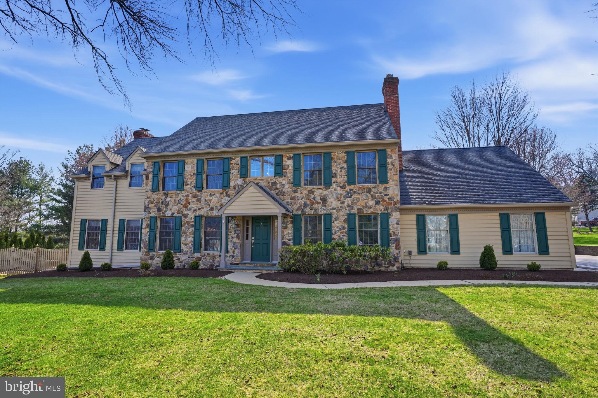 Welcome home to this STUNNING 5 bedroom home located in the highly sought-after Hunters Crossing community of Doylestown. Ideally set on just under an acre along a quiet, tree-lined street in the prestigious Central Bucks School District, this exceptional home is ready for you to move right in. Beautiful hardwood flooring, state of the art upgrades, and a refined neutral palette throughout create the perfect balance of luxury, style, and comfort. As you arrive, you’ll immediately notice the elegant stone retaining wall and freshly manicured landscaping that create a striking first impression.  Step inside to an impressive, sun-drenched foyer with soaring ceilings highlighted by a beautiful statement chandelier. The foyer is flanked by a bright and spacious living room, anchored by a wood-burning fireplace, and a formal dining room—both enhanced with elegant crown molding and chair rail detailing. Continue down the hallway past a convenient coat closet to the heart of the home: a gorgeous eat-in kitchen featuring a large center island, granite countertops, stylish tile backsplash, stainless steel appliances, a gas cooktop, double wall oven AND a large pantry closet! A casual dining area with sliding glass doors to the backyard deck is perfect for indoor/outdoor entertainment!  Just off the kitchen, the cozy family room offers timeless charm with beamed ceilings and a wood-burning stove set against a brick accent wall. A convenient wet bar and direct access to the backyard deck elevate this space making it ideal for both relaxed everyday living and effortless entertaining. A private home office with custom built-in bookshelves sits just beyond, ideal for today’s flexible lifestyle. Completing the main level is a powder room and a dedicated laundry/mudroom with convenient outdoor access and direct entry to the attached three-car garage. Upstairs, you’ll find four spacious bedrooms, each filled with natural light and ample closet space. Step into the luxurious primary suite, impressive in scale offering ample room for a separate sitting area. Truly a private retreat your primary suite also features an expansive walk-in closet and a spa-inspired en suite bathroom with skylights, dual sink vanity, a soaking tub, and a floor-to-ceiling tiled stall shower with sleek glass doors. At the other end of the hall, you'll find a versatile junior suite that can easily serve as a fitness space, office, or hobby room. A spacious connecting closet links two distinct areas, with the option to easily convert the layout into two separate rooms for added flexibility. A full hallway bathroom featuring a skylight, dual sink vanity, and tub/shower combo round out the upper floor. The fully finished basement expands your living space with a large room ideal for recreation or additional family room, a NEW full bathroom with stall shower, and the 5th bedroom—perfect for guests or extended stays. Additionally, an unfinished section provides ample storage.  Step outside to your private backyard oasis where an expansive deck with awning sets the stage for enjoying your morning coffee or entertaining friends and family. A fenced in-ground pool provides the perfect retreat for summertime leisure, while the open lawn offers abundant space for outdoor games and recreation. A bonus shed adds convenience for storing all your outdoor essentials. This home features a 3 car garage equipped with hardwiring for an EV charger AND NEW garage door openers.   Other recent upgrades include NEW plush carpeting throughout, newly installed professional grade drainage system, NEW water softener system (2023) with a UV sterilizer and an added RO system to the water in 2025, NEW 6” gutters, and NEW HVAC recently upgraded to propane heating (NO OIL)! Close to restaurants, shopping and parks AND near Doylestown Station and Route 202 for easy commuting! Central Bucks school district (CB EAST!) too! Don’t miss your opportunity to see this beautiful home today!