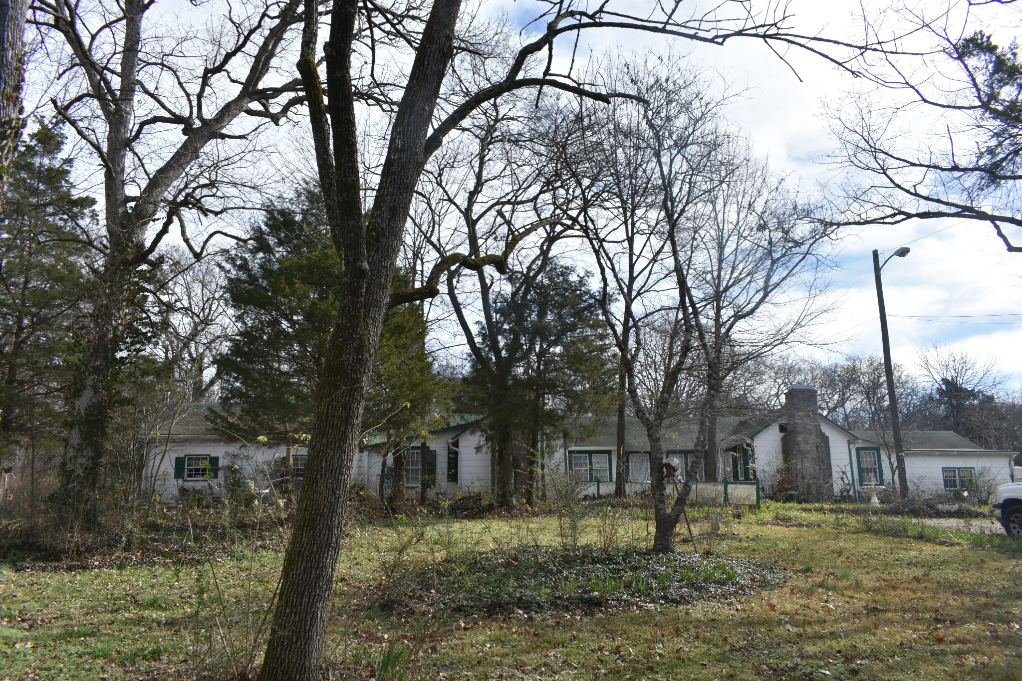 We have this older Home/Duplex, that was built in the 1900's with log walls inside, that has been added onto several times. multiple kitchens, and lots of rooms. Sitting on 2.15 ac. with a detached garage, wood burning fireplaces, This home would be great for rentals, or for a large family. Large Fenced in back yard, wood burning fireplaces, hardwood floors, and much more.