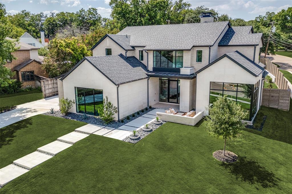 Don't miss this stunning new construction home located on a rare .36 acre corner lot in one of Lakewood's best pockets!  Only 1 block from White Rock Lake, you will appreciate the elevated and refined transitional design.  Exceptional craftsmanship, thoughtfully curated finishes and premier amenities abound at every turn.  Enjoy the light and bright open floorplan with stunning Weather Shield windows and door systems.  The spacious gourmet kitchen with Mont Blanc quartzite counters opens to the the living room and features a Sub Zero & Wolf appliance package with 48 inch dual fuel range and column fridge, column freezer and glass front column wine storage. Huge island is perfect for everyday living. Around the corner from the kitchen, you will find a large walk in pantry and prep kitchen with beverage drawers and nugget ice maker.  The palatial primary suite enjoys abundant natural light and has patio door leading to a fire pit area.  The spa like primary bath features Lasa Venata marble counters, cle travertine pavers and Zellige tile. The custom primary closet features large island along with ample storage and lighted cabinets to display your favorite purses and watches.  You will love the stunning office with 2 walls of floor to ceiling glass along with built in cabinet and beverage drawers.  Second downstairs living area allows for many different uses and opens directly to the covered patio.  You won't believe the size of the back yard that will allow for a pool, sport court and grass! The covered outdoor kitchen features grill, fridge and sink.  Upstairs you will find 4 large bedrooms and upstairs game room perfect for kids. Large utility room features ample built in storage and sink with an additional full size stackable utility room upstairs.  3 total garage spaces feature epoxy flooring.  Welcome home!