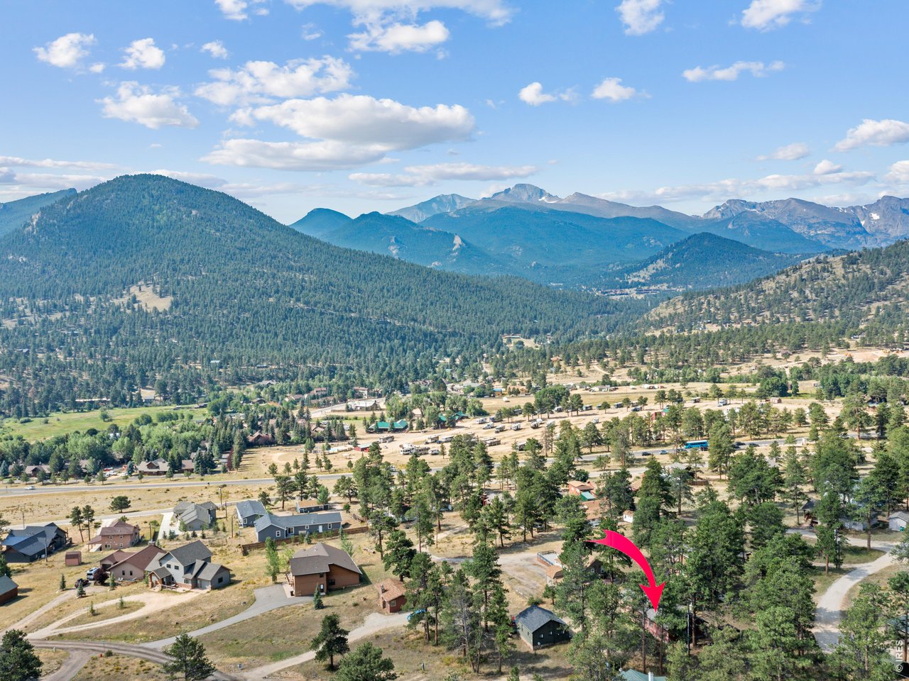 Tucked among the pines in Estes Park's sought-after High Drive neighborhood, this inviting mountain retreat offers the perfect balance of comfort, privacy, and adventure. Located just minutes from Rocky Mountain National Park, you'll enjoy easy access to miles of hiking trails, wildlife viewing, and some of Colorado's most spectacular scenery right from your doorstep. Built in 2008 on the cherished site of a longtime family cabin, this 3-bedroom, 2-bath home carries forward a legacy of mountain living while providing the conveniences today's buyers appreciate. The floor plan creates a warm and welcoming gathering space, anchored by a cozy gas fireplace that invites you to relax after a day spent exploring the Rockies. Large windows bring in natural light and frame the peaceful setting beyond. The primary suite is a private retreat complete with an ensuite bath and separate exterior entrance, providing flexibility for guests, a home office, or additional privacy. Two additional bedrooms ensure plenty of room for family and friends to share in the mountain experience.Whether you're searching for a full-time residence, a seasonal escape, or a place where future generations can create lasting memories, this property offers a rare opportunity to embrace the Estes Park lifestyle in one of the community's most desirable locations.