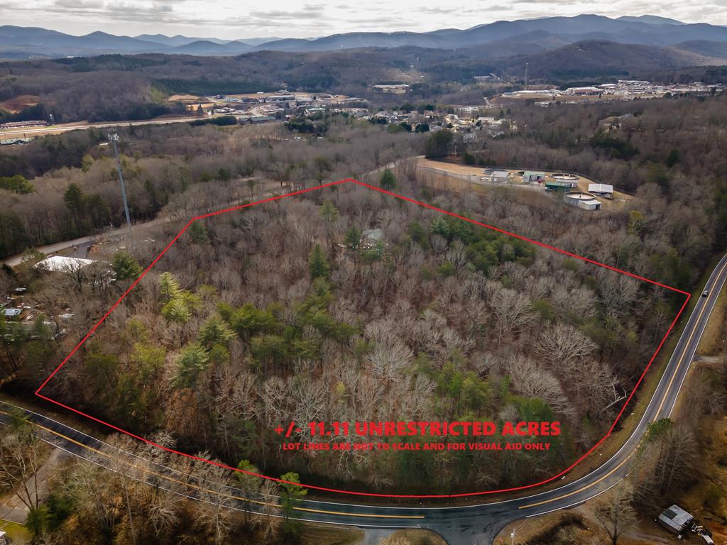 Seize this rare chance to own over 11 acres of prime land, conveniently located just minutes from the vibrant heart of downtown Blue Ridge. With both city sewer and water services available, this property offers unparalleled flexibility and potential.  Whether you're envisioning a stunning single-family estate or exploring the boundless possibilities of mixed-use commercial development, this parcel can accommodate your dreams. Its strategic location, combined with essential utilities, makes it a perfect canvas for various ventures.  Don't miss out on this exceptional investment opportunity in one of Blue Ridge's most desirable areas.