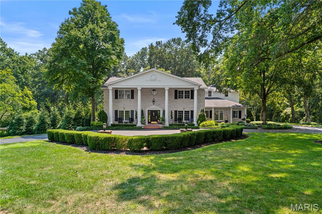 Nestled on a 3.56-acre park-like setting, this elegant home offers refined living inside and out. A dramatic two-story foyer with a grand staircase leads to formal living and dining rooms with detailed millwork and hardwood floors. The open-concept kitchen, breakfast area, and family room form the heart of the home. The kitchen has a La Cornue stove, Wolf and Sub-Zero appliances, refrigerator drawers, a Wolf wall oven, a Wolf microwave, a warming drawer, an In-counter Wolf steamer, and a center island. Full dish-and-light appliance room. Sliding glass doors open to a private patio, pool, and gazebo—perfect for entertaining. The spacious primary suite includes two walk-in closets and a bath with a soaking tub, steam shower, and dual vanities. Over the garage is a large bonus room ideal for an office or playroom. The finished lower level includes a wet bar, full bath, 1,600-bottle wine cellar, and walk-out access to the heated pool. Three-car attached garage, complete irrigation system & whole house generator. Enjoy privacy and tranquility in this premier gated community that backs to a 50-acre private equestrian property!