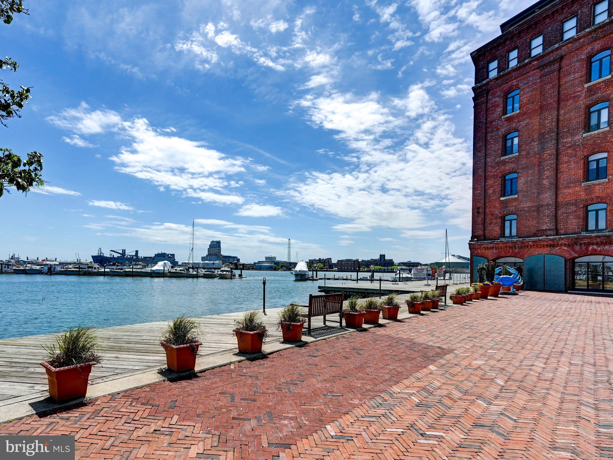 Welcome to 1000 Fell Street #411—where historic charm meets modern urban living in the heart of Fells Point. Nestled along Baltimore’s iconic waterfront, this beautifully updated 1-bedroom, 1-bath loft-style condominium offers the perfect blend of character, convenience, and style.Step inside to discover an open, airy layout highlighted by stunning exposed brick and oversized windows that fill the space with natural light overlooking the English garden courtyard. The home features new hardwood throughout and a thoughtfully updated kitchen featuring modern finishes, sleek cabinetry, and ample counter space—ideal for both everyday living and entertaining. The renovated bathroom offers a clean, contemporary feel that complements the home’s historic charm. The spacious loft-style bedroom provides a comfortable retreat, while the overall design maintains a perfect balance of industrial character and modern upgrades.Enjoy the convenience of one included garage parking space, a true luxury in this vibrant, walkable neighborhood. Just steps from the waterfront promenade, renowned restaurants, boutique shopping, and lively nightlife, this location offers the very best of city living.Whether you're seeking a full-time residence or a stylish city getaway, this exceptional property delivers the quintessential Fells Point lifestyle.