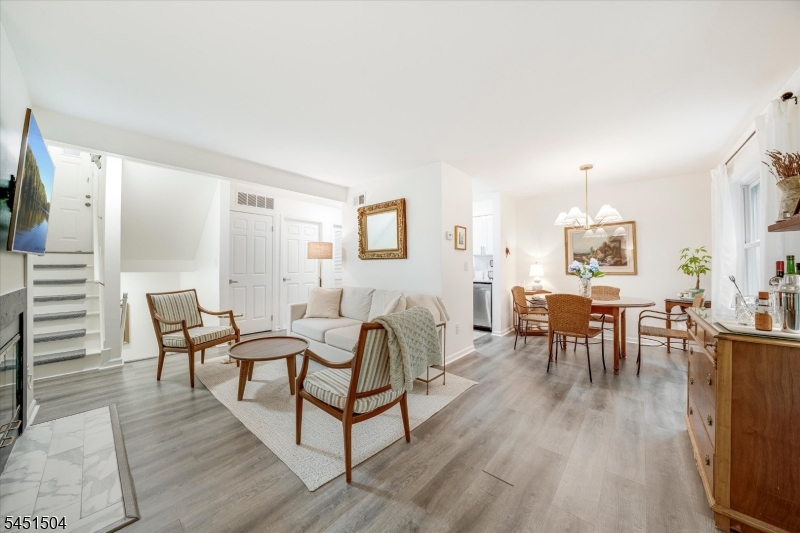 Stunning turnkey 2-bed, 1.5-bath Copper Beech condo in Madison, NJ, boasting renovations over the past few years Enjoy two-level living in a wooded setting beside Drew University, directly across from the beautiful Giralda Farms walking and biking trails.The updated kitchen features stainless steel appliances and a beautiful new backsplash. Renovated bathrooms, new flooring, and a clean, modern finish leave nothing to do but move in. The main level offers a spacious living room with a wood-burning fireplace, a dining area, a powder room, and a private deck overlooking the protected woodland of the Zuck Arboretum. Downstairs, two bedrooms share a full bath, and the primary bedroom includes a large walk-in closet.Low-maintenance living includes one assigned parking space, ample guest parking, a private storage closet by the front door, and a large storage area for luggage and bikes.Madison delivers low taxes, a top-rated school, and a vibrant downtown with shops and restaurants. Nearby the Madison train station for an easy NYC commute. Morristown and major highways sit minutes away.  Move-in ready in an unbeatable Madison location!