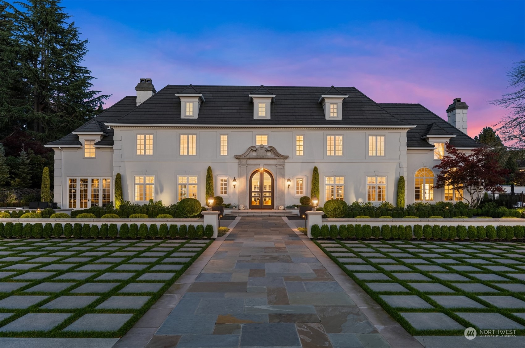 Extraordinary Chateau in the Heart of Clyde Hill – this 1.5-acre gated estate epitomizes enduring elegance and modern grandeur, minutes from Downtown Bellevue. Poised amidst meticulously designed grounds, this timeless European-style residence offers sweeping vistas of Lake Washington, Seattle skyline, and Olympic Mountains. Reimagined to perfection during a three-year renovation, its refined interiors blend timeless European charm with modern sophistication, enhanced by state-of-the-art technology. Beyond the residence, a private sanctuary unfolds—a luxurious pool and spa, tennis/pickleball court, showcase gardens of symmetry and beauty, and a pavilion for leisure and celebration. A rare offering in the PNW.