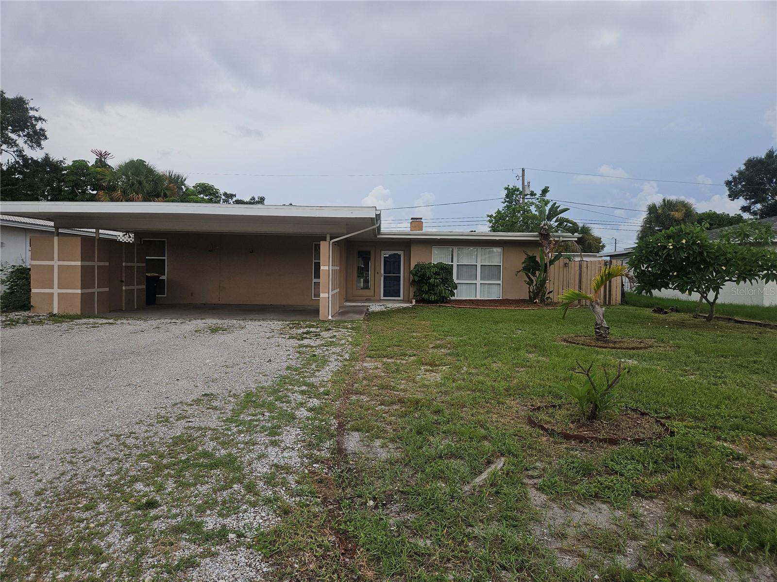 Investor Special with Endless Potential! This 3-bedroom, 2-bath home is being sold AS-IS and offers an excellent opportunity for investors, flippers, or buyers looking to renovate and build equity. Features include a fireplace, spacious Florida room, in-ground pool, covered carport, and a fully fenced backyard. With a desirable layout and outdoor space, this property is ready for your vision and updates. Conveniently located near schools, shopping and Florida's beautiful beaches. Cash or renovation financing recommended.
