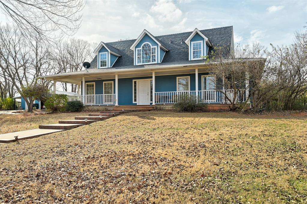 Stunning one-owner custom country farmhouse offering 2,314 SF of comfortable living on a beautifully treed 4-acre parcel that can be divided into two buildable 2-acre lots—perfect for multigenerational living or future investment—and situated close to the new turnpike for easy access to Tulsa and Oklahoma City. This 3-bedroom, 2 1/2-bath home features a classic wraparound front porch, covered back porch, freshly remodeled kitchen with an oversized gas range and farmhouse sink, plus an oversized primary suite on the main level with a two-person shower and generous walk-in closet, and abundant natural light throughout. Additional living spaces include a dedicated office and a sunroom.   The oversized two-car garage includes an additional overhang to work under or store firewood, and a 5' x 8' storm shelter to protect all your loved ones. The lots are heavily treed and the neighborhood has paved roads leaving to this beautiful treasure.   Modern updates include an impact-resistant roof installed November 2025 and both HVAC units were added in 2021. This home is offered at an affordable price of $415,000.  Come view this home today!